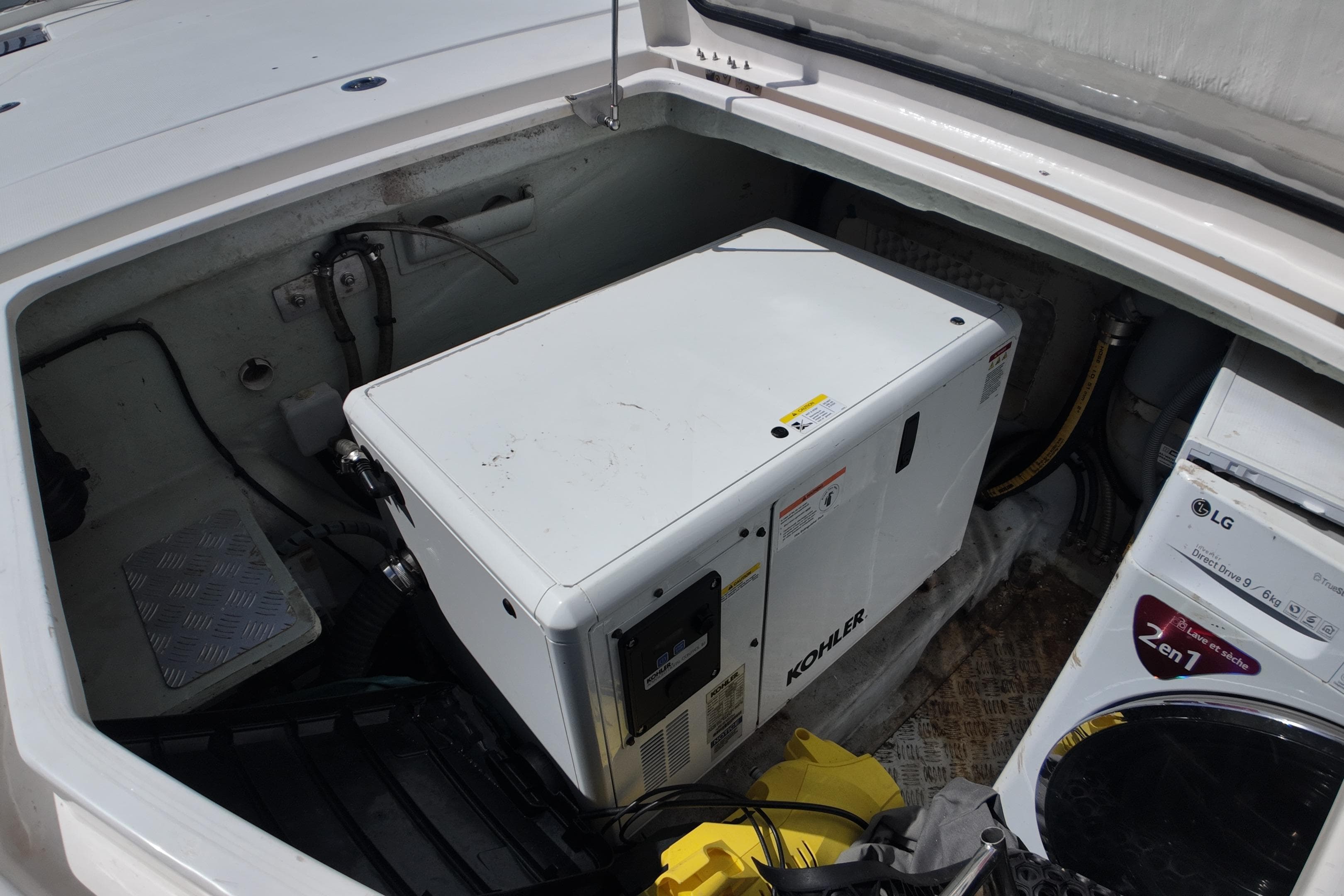 Engine compartment of 2017 Leopard 51 Powercat with Kohler generator and LG washer.