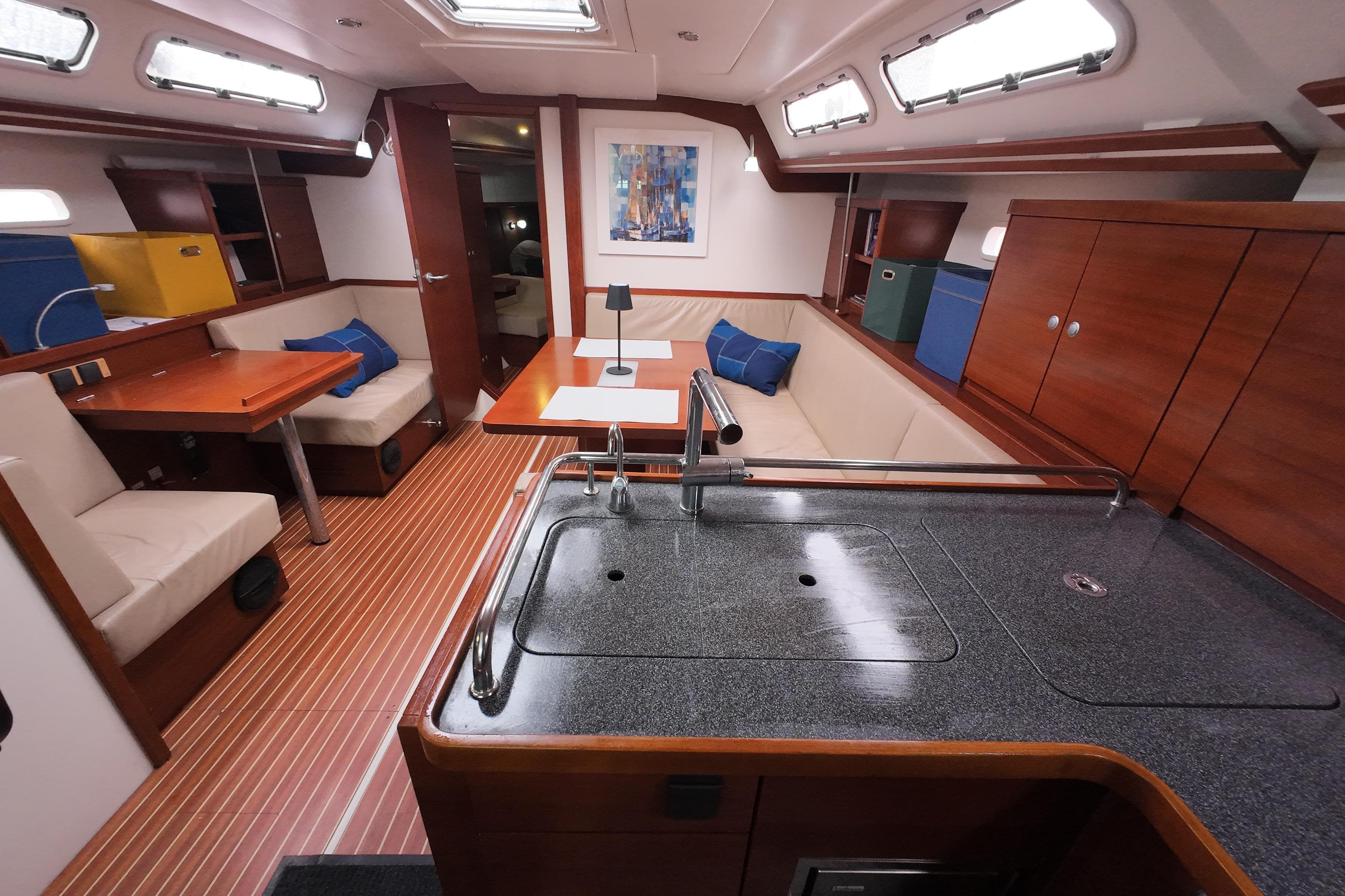 Interior of 2007 Hanse 430e yacht with modern kitchen and cozy seating area.
