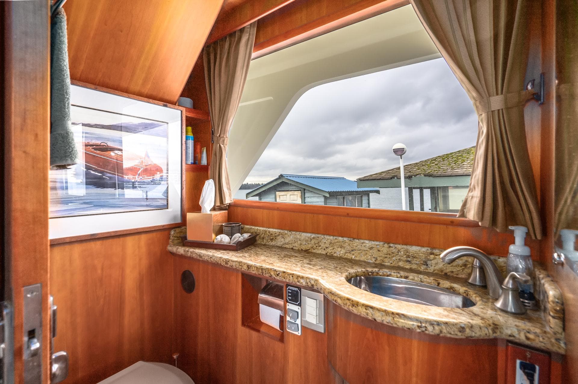 Luxurious bathroom in 2005 President 680 Skylounge yacht with scenic window view.