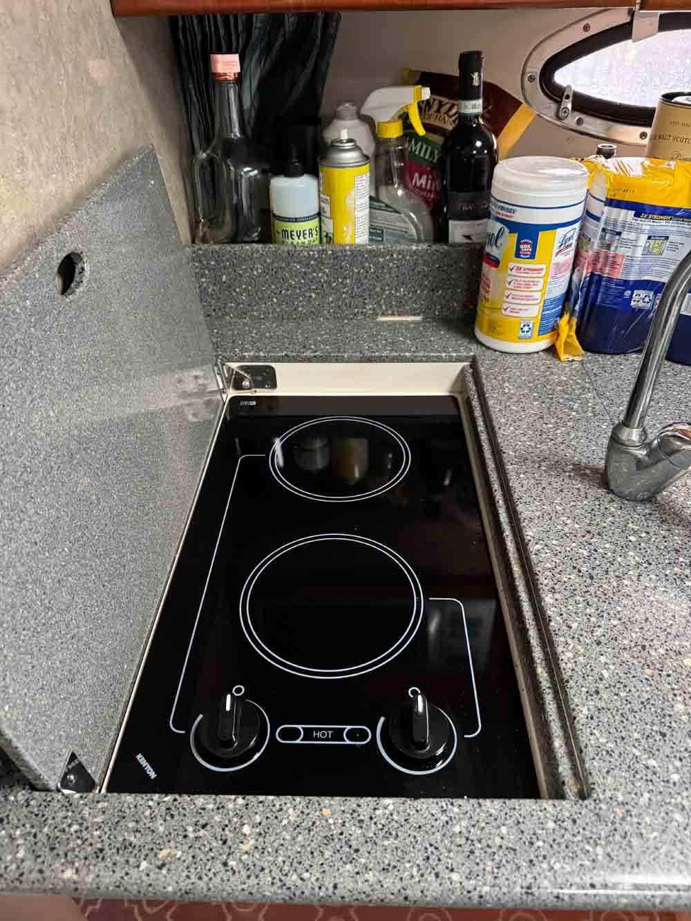 2005 Formula 31 Performance Cruiser kitchen with electric stove and granite countertop.