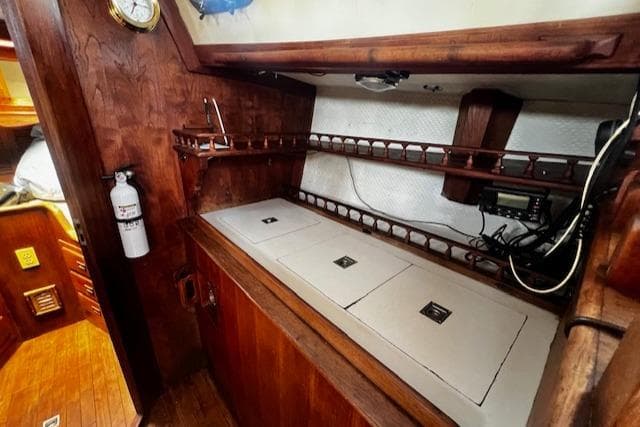 1978 Custom Fantasia C/C Double Ended Cutter interior with wooden cabinetry and storage compartments.