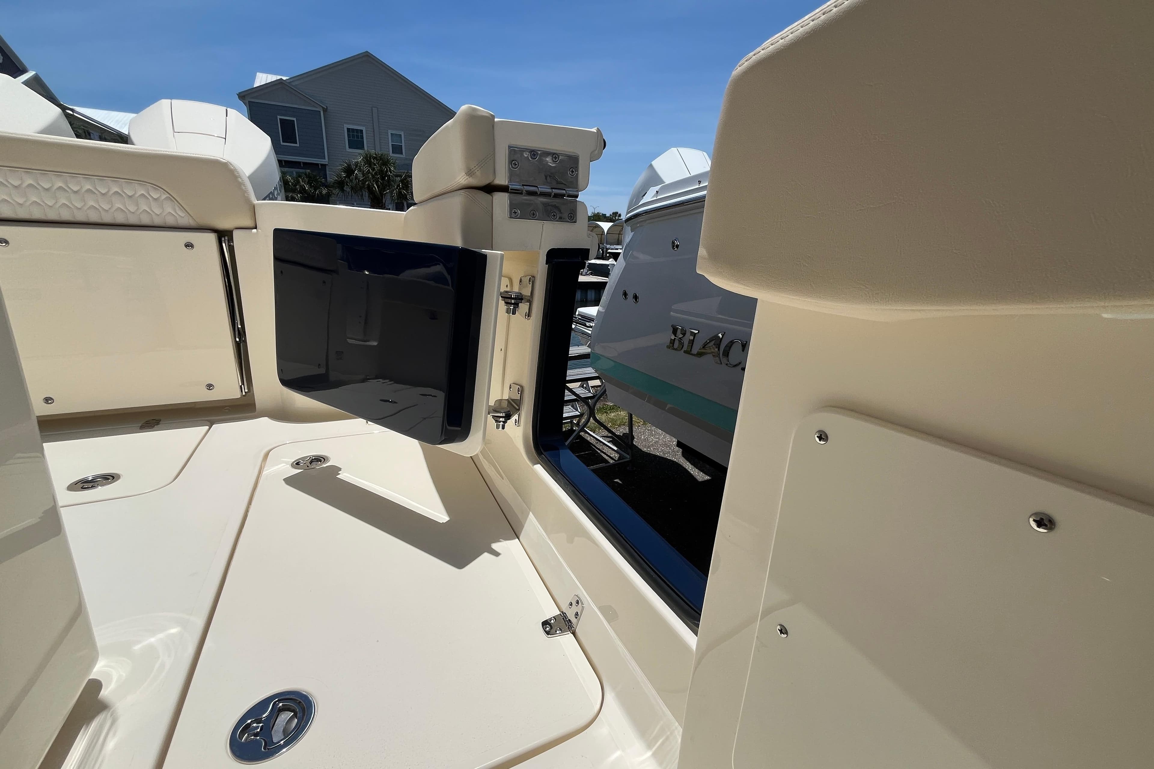 2026 Scout 260 LXF boat interior with open storage compartment, showcasing sleek design.