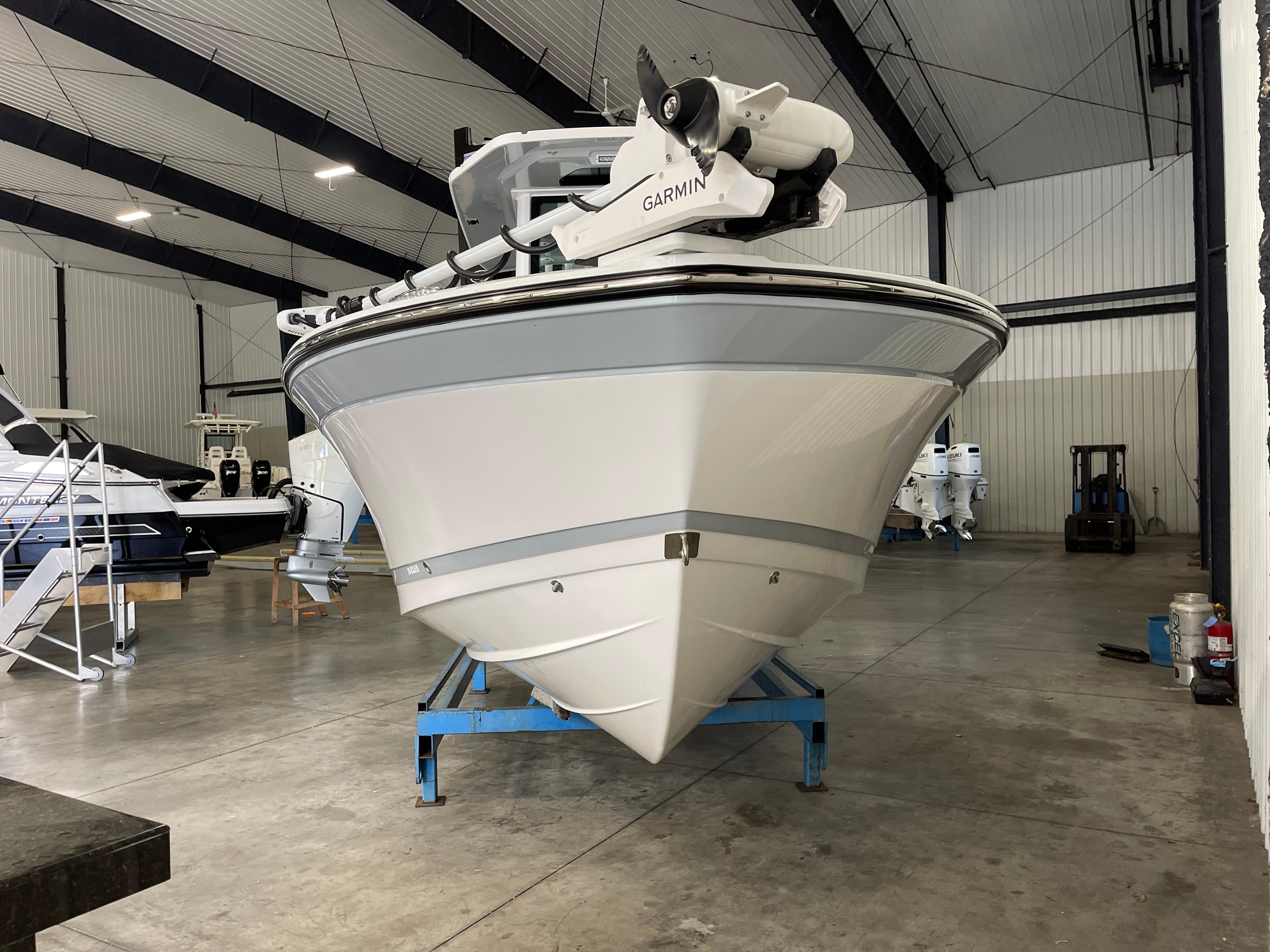 2026 Blackfin 262 HB boat in a spacious indoor storage facility.