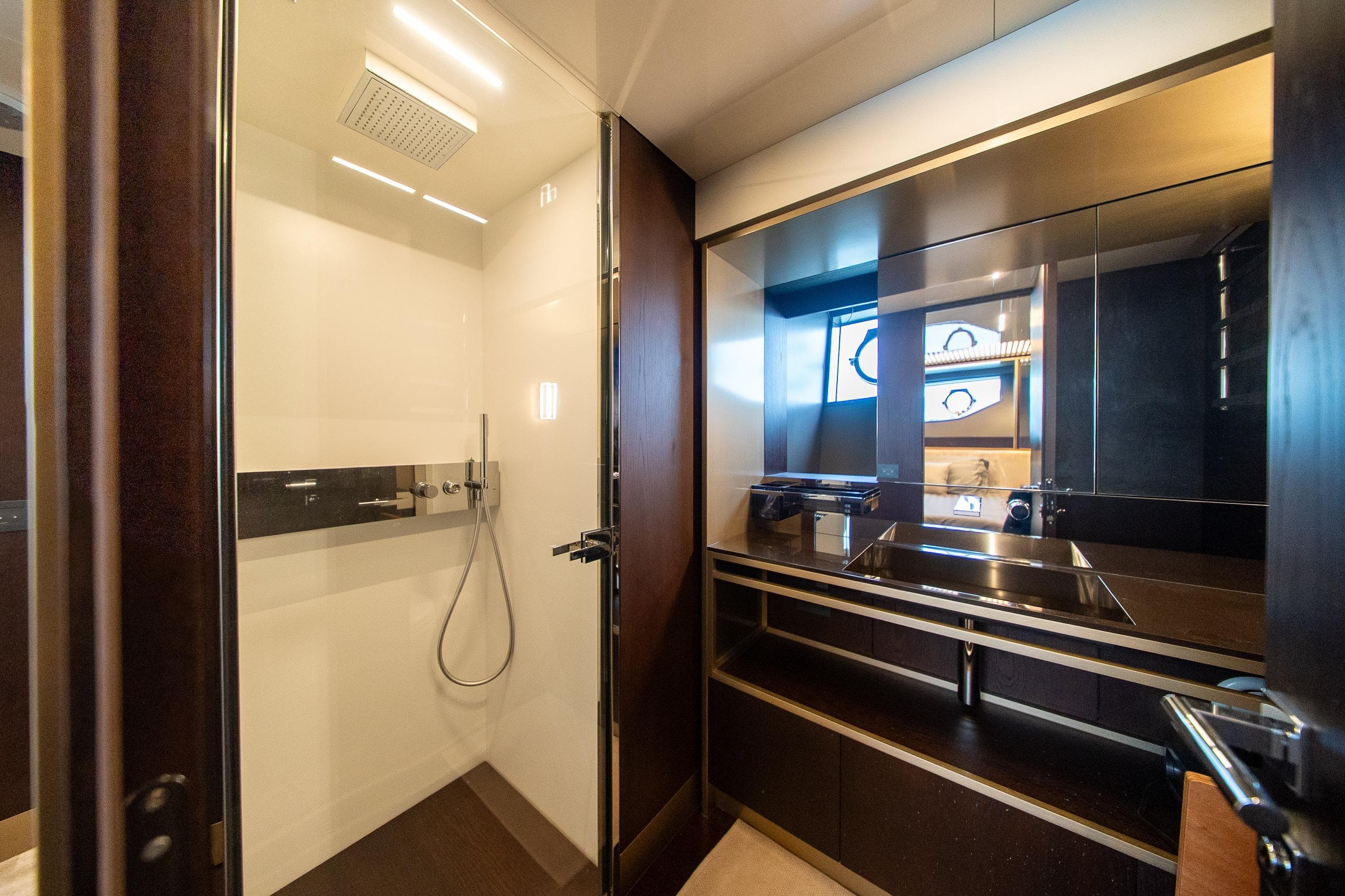 Luxurious bathroom interior of 2020 Ferretti Yachts 850, featuring modern shower and sleek vanity.