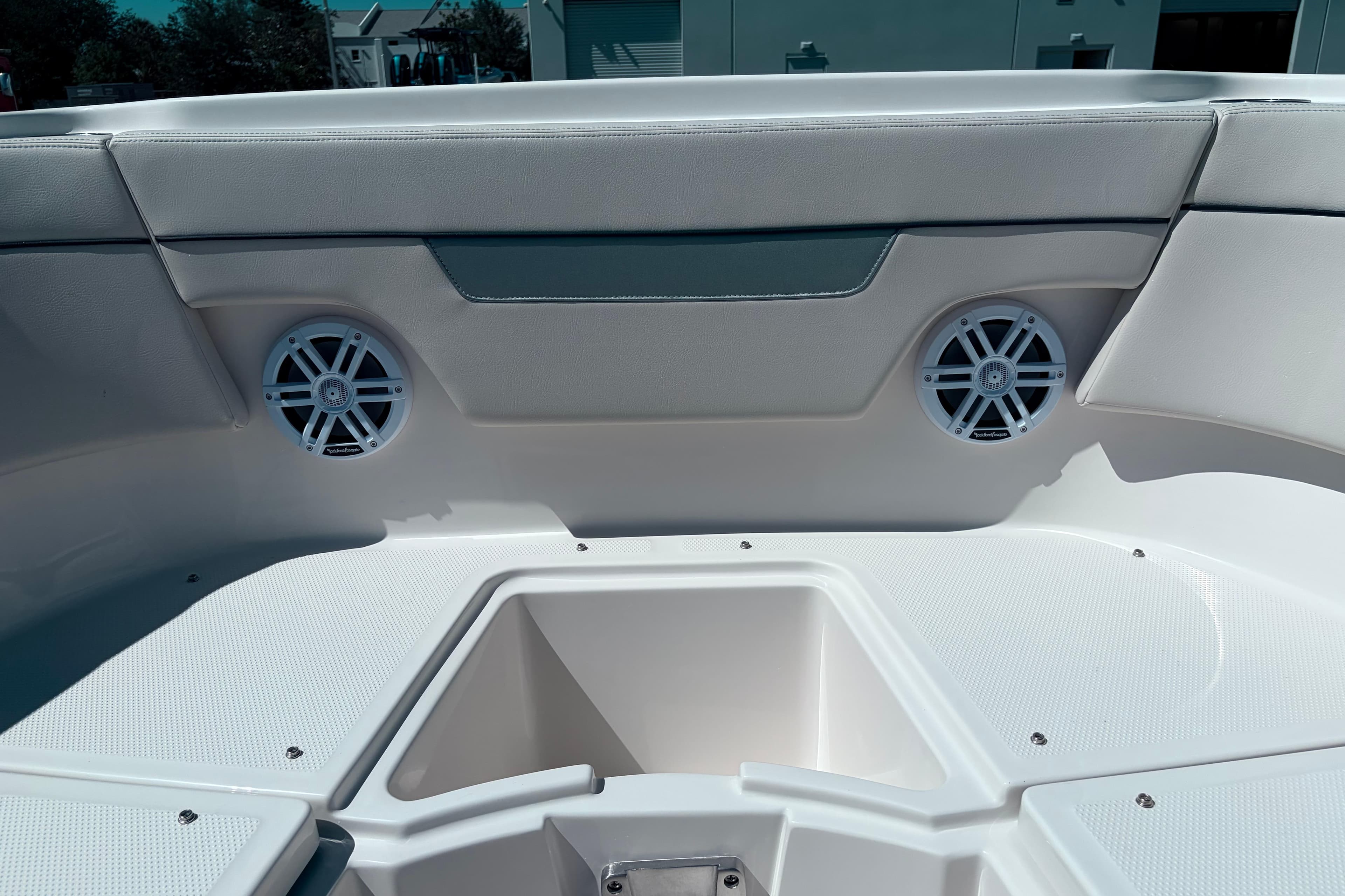 2026 Sailfish 252 CC boat interior with speakers and storage compartment.