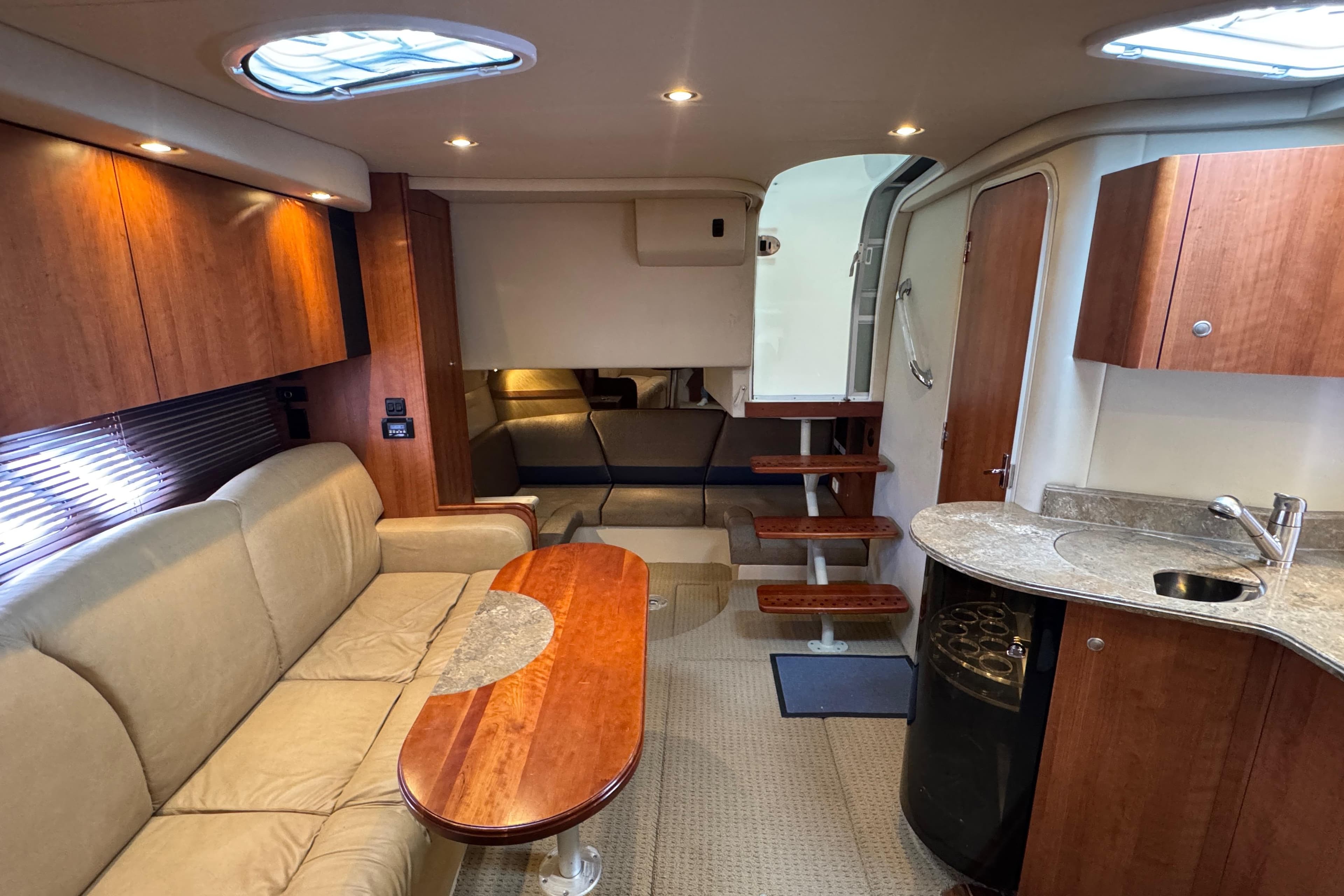Luxurious interior of 2008 Cruisers Yachts 360 Express with elegant seating and kitchenette.