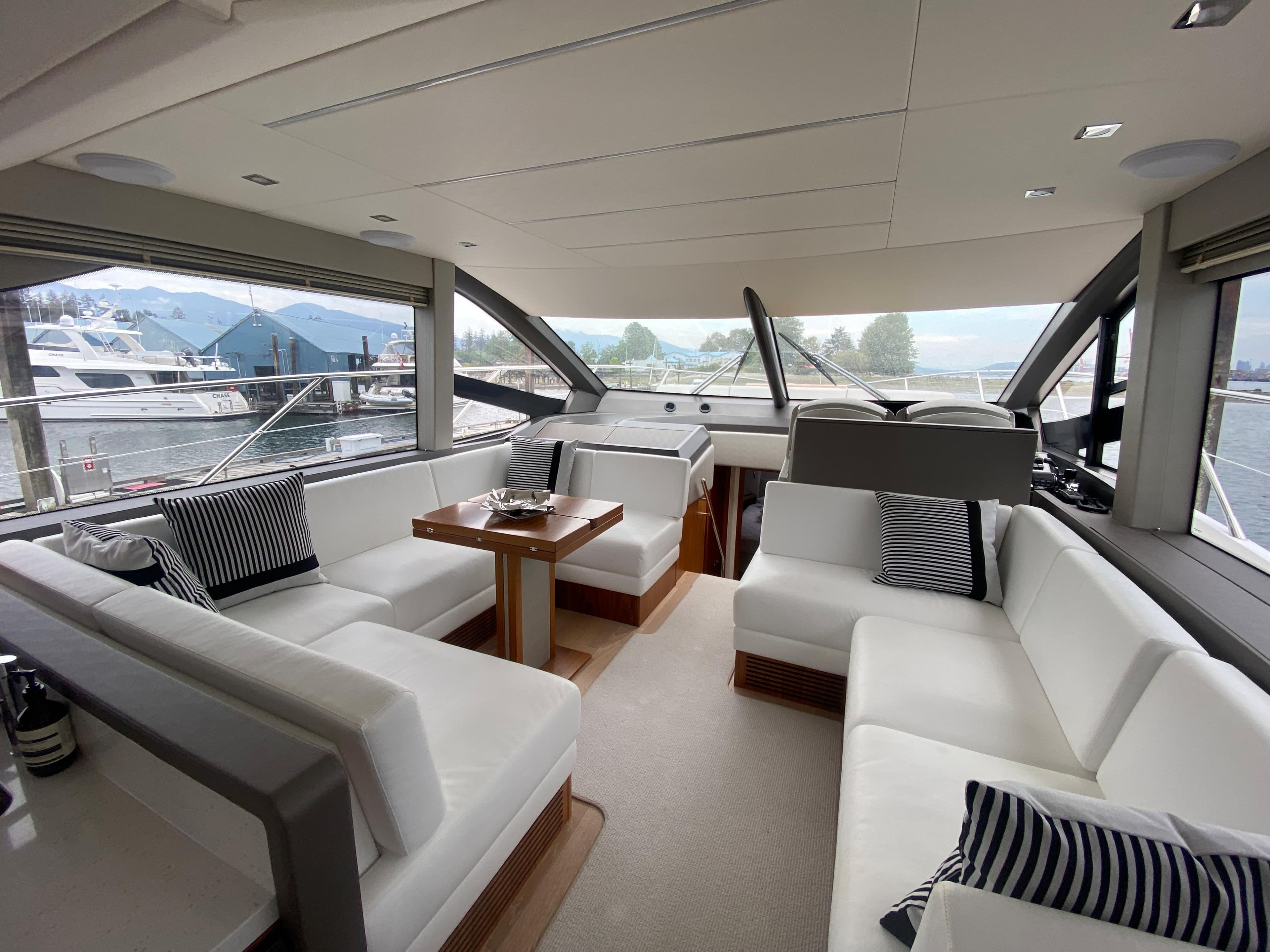 Luxurious interior of 2020 Sunseeker Manhattan 52 yacht with elegant seating and panoramic windows.