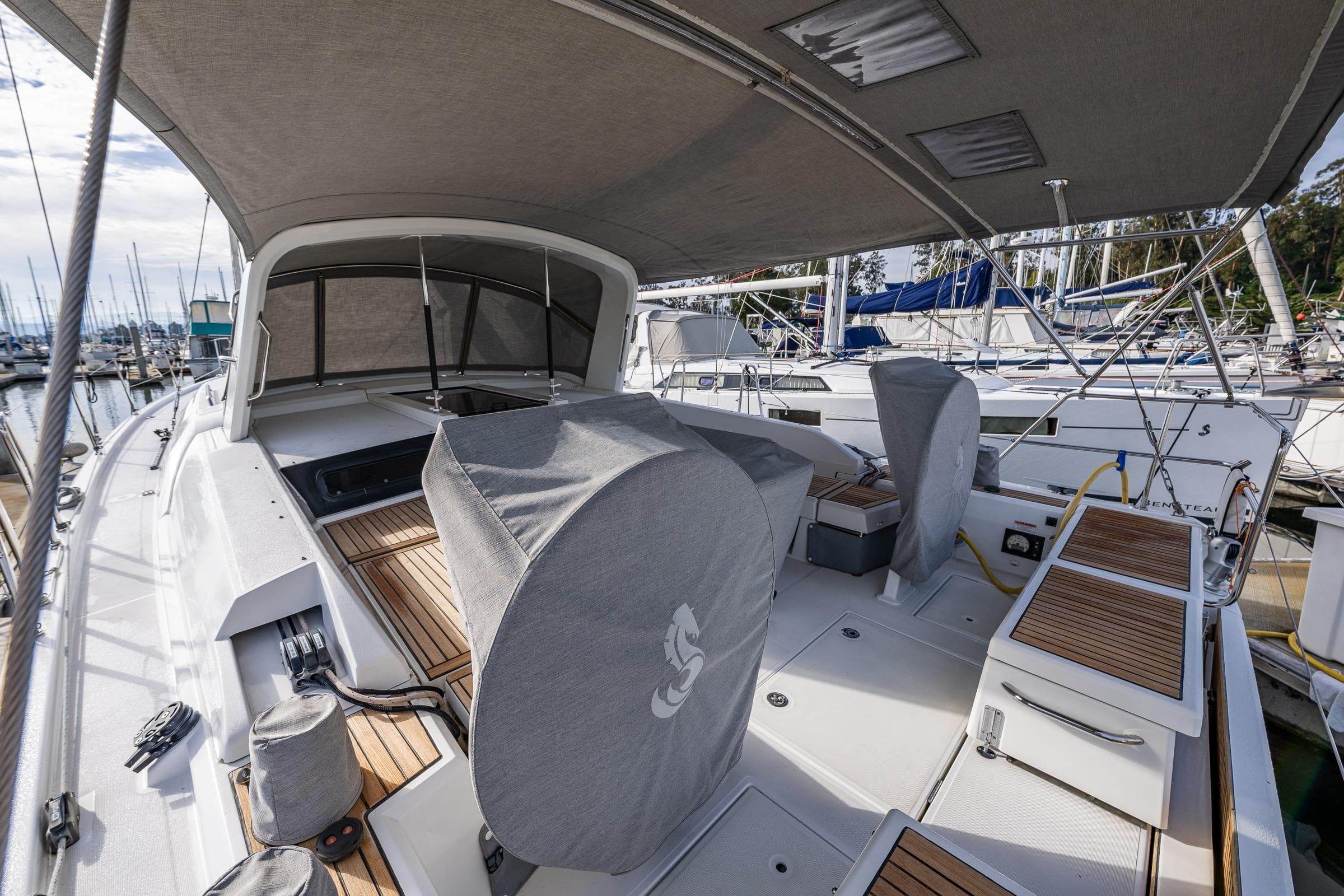 2020 Beneteau Oceanis 46.1 yacht with covered cockpit, docked at marina.
