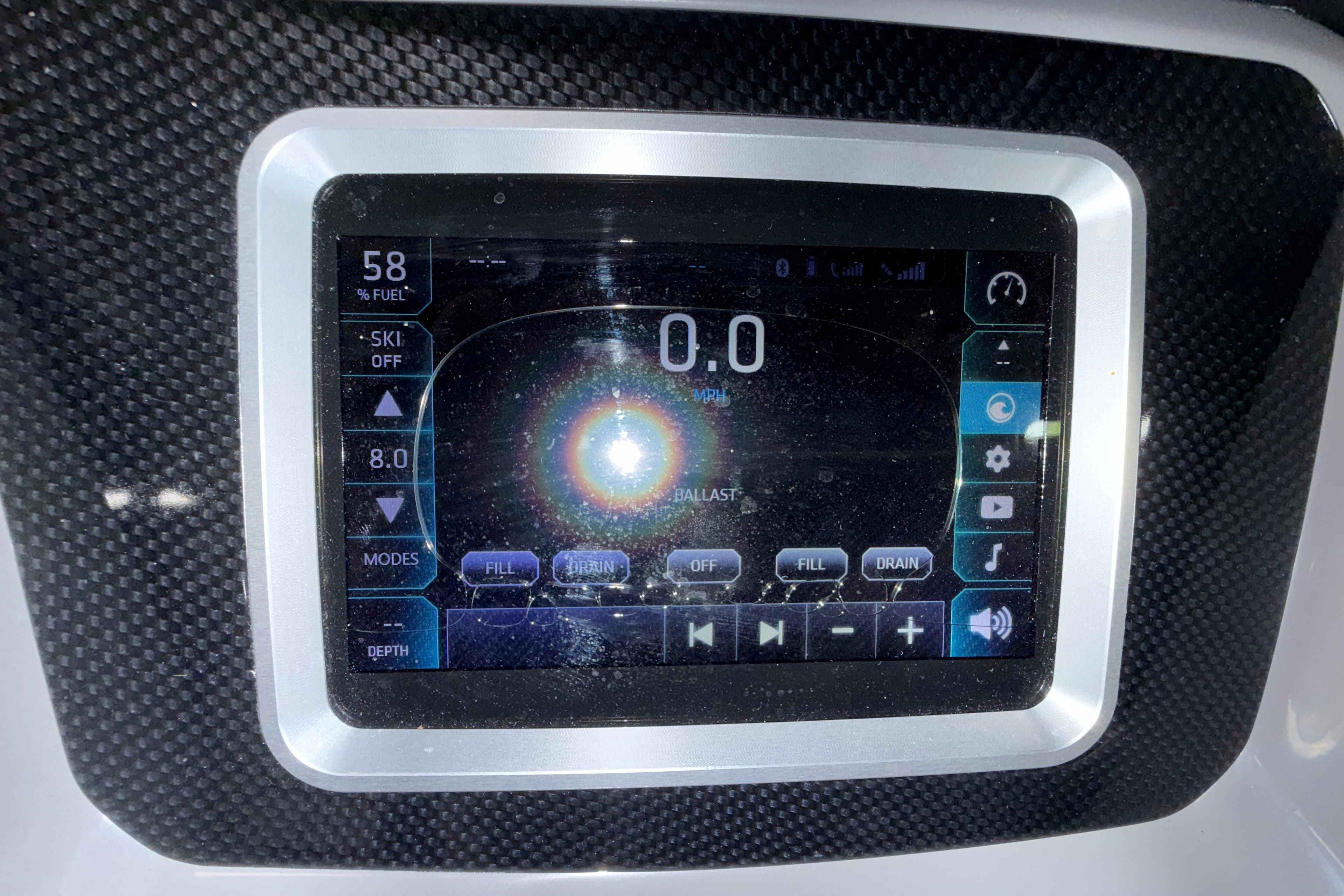 Touchscreen display of 2019 Chaparral Vortex 2430 VRX Wake Series boat dashboard.
