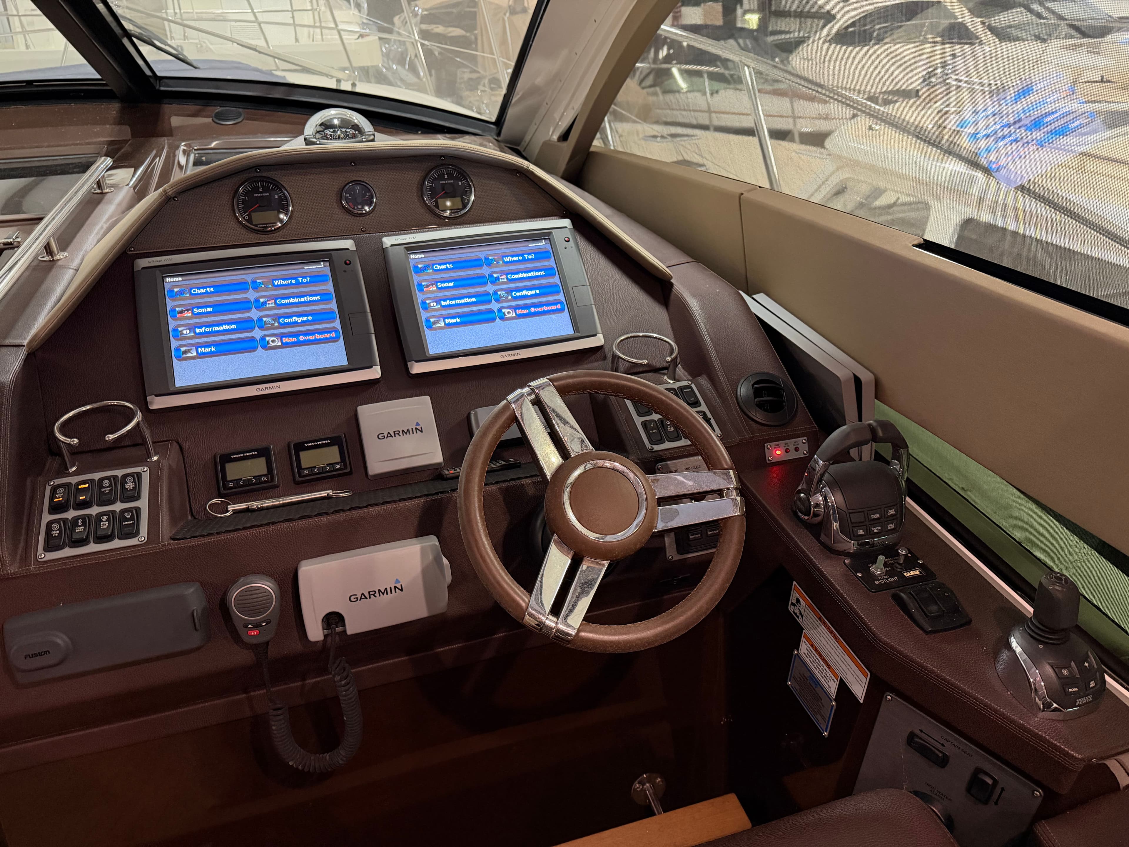 2014 Regal 52 Sport Coupe helm with dual Garmin displays and modern controls.