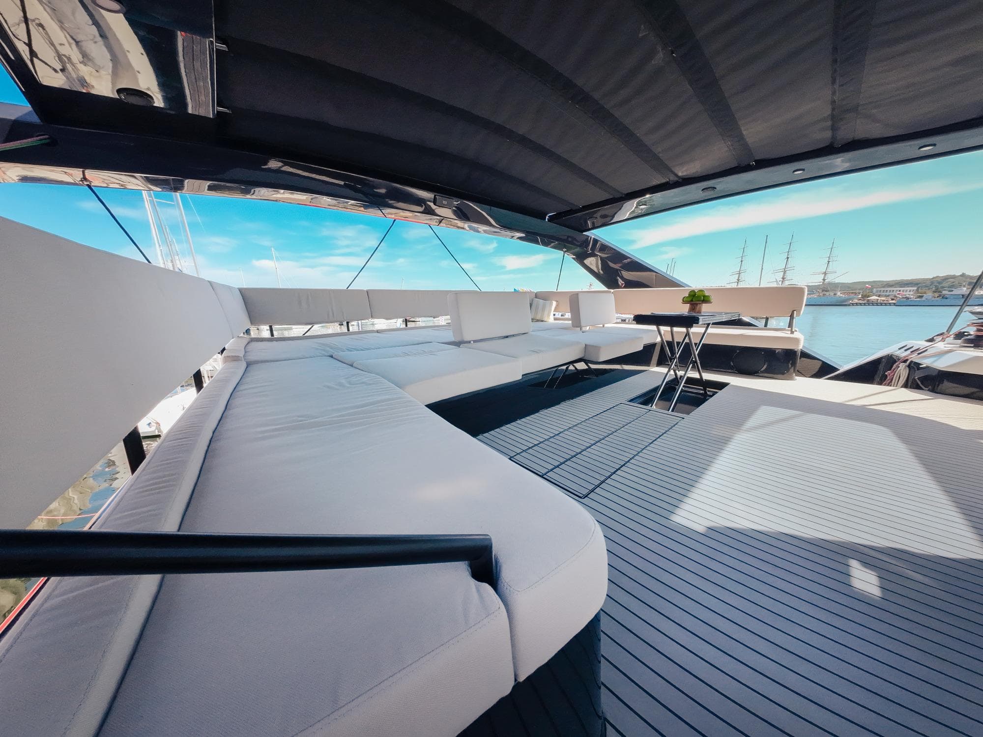 Luxurious 2024 Wave 60 yacht deck with modern seating and ocean view.