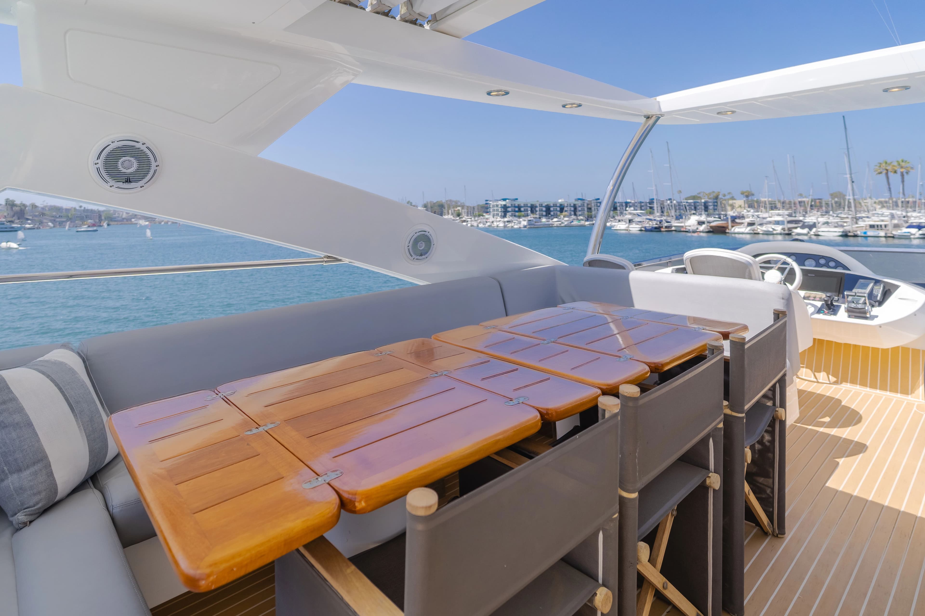 Luxurious outdoor area of Sunseeker 88 Yacht, 2011, featuring dining table and sea view.
