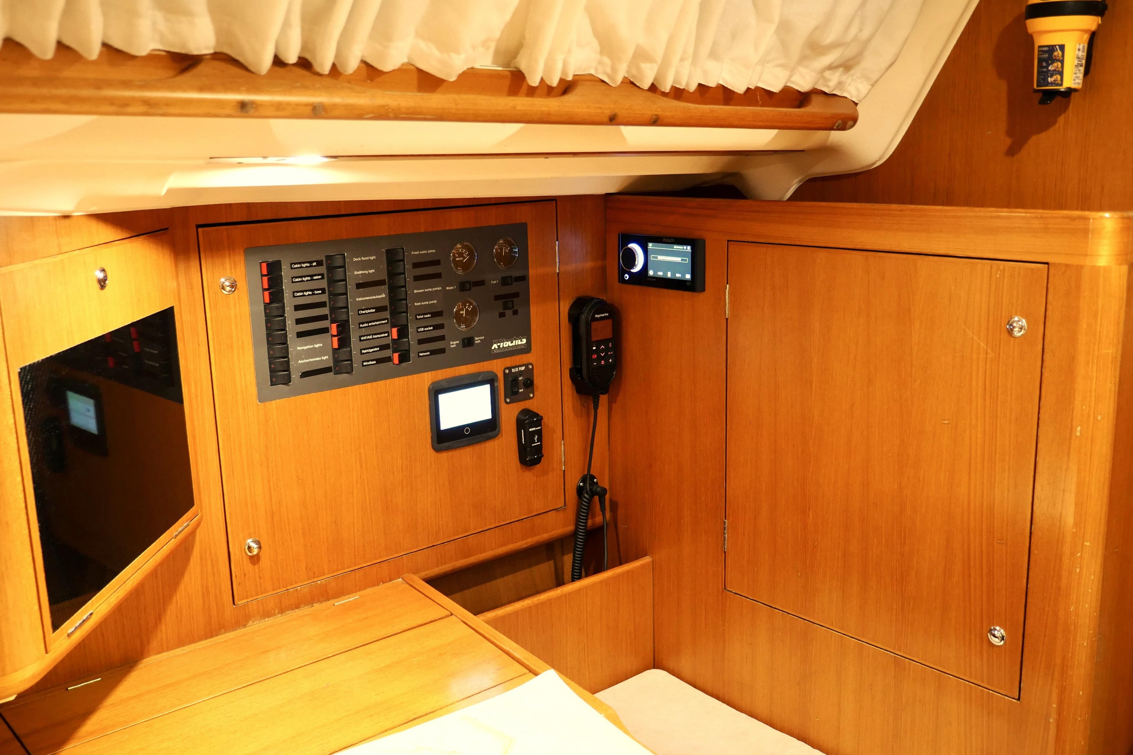 Interior of 2004 X-Yachts X-46 sailboat, featuring control panel and communication equipment.