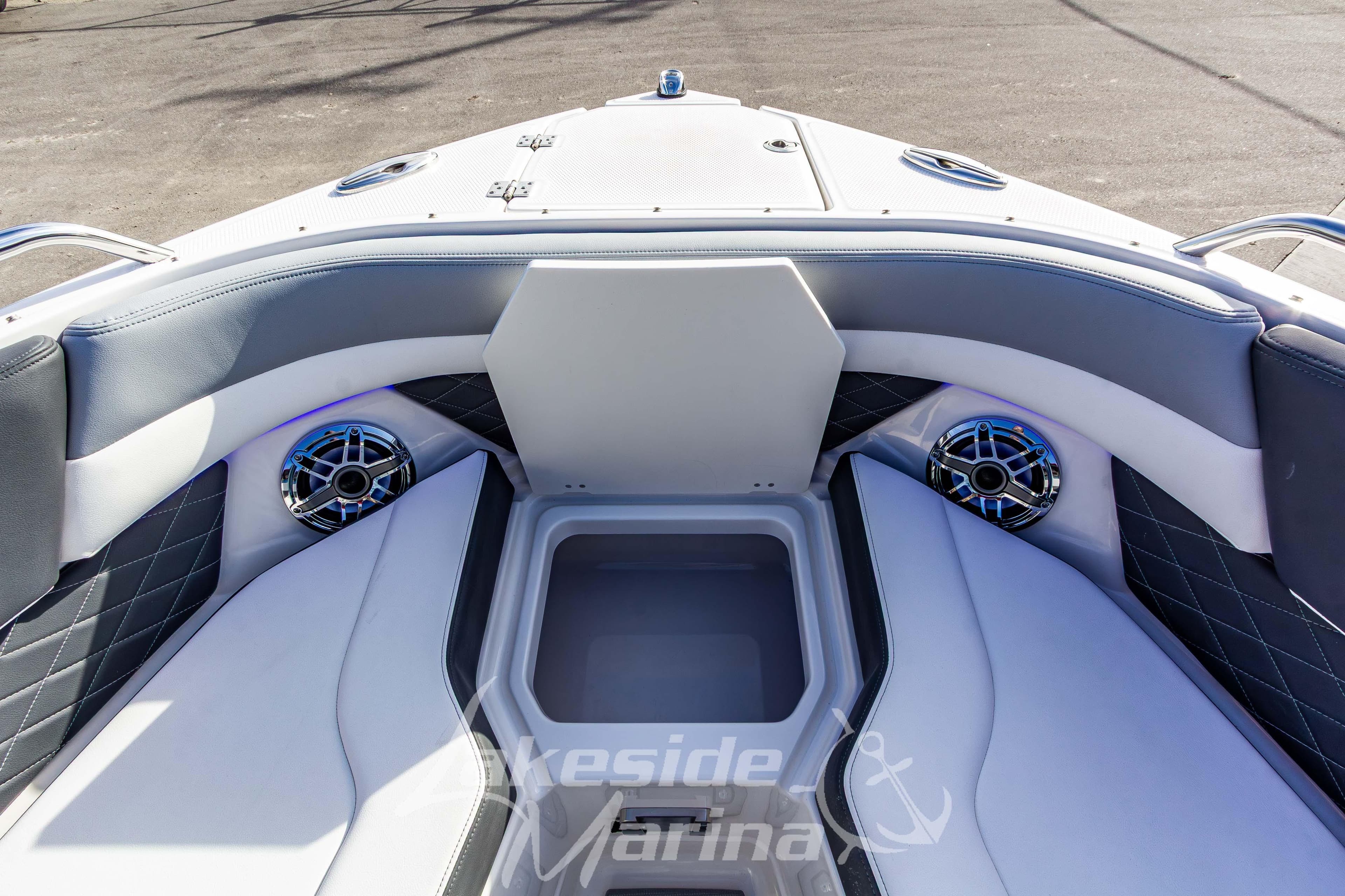 Interior of 2026 Chaparral SSX 6 boat with cushioned seating and speakers.