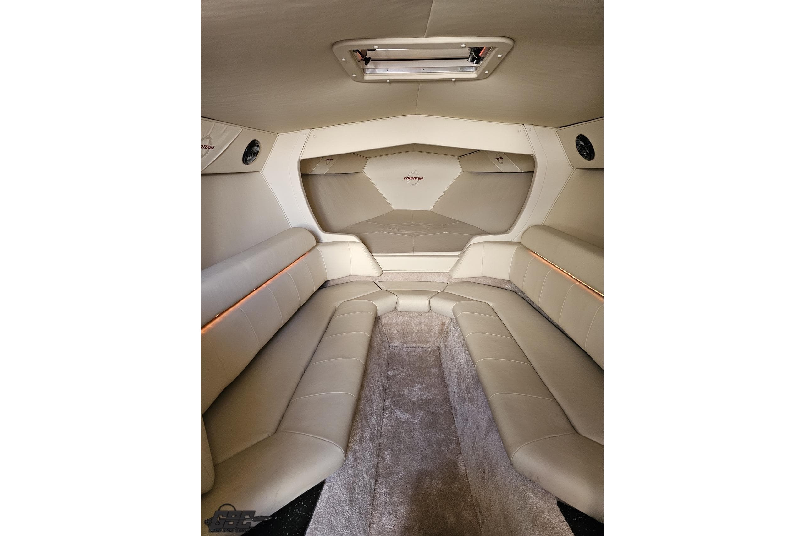 Interior of 2009 Fountain 47 Lightning boat with beige seating and modern design.