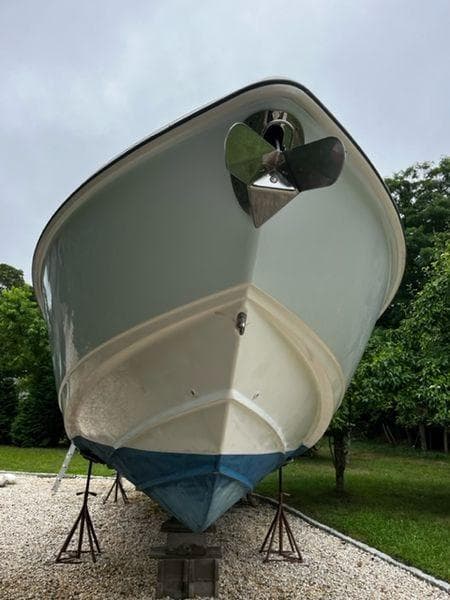 2004 Boston Whaler 320 Outrage boat on stands, front view.