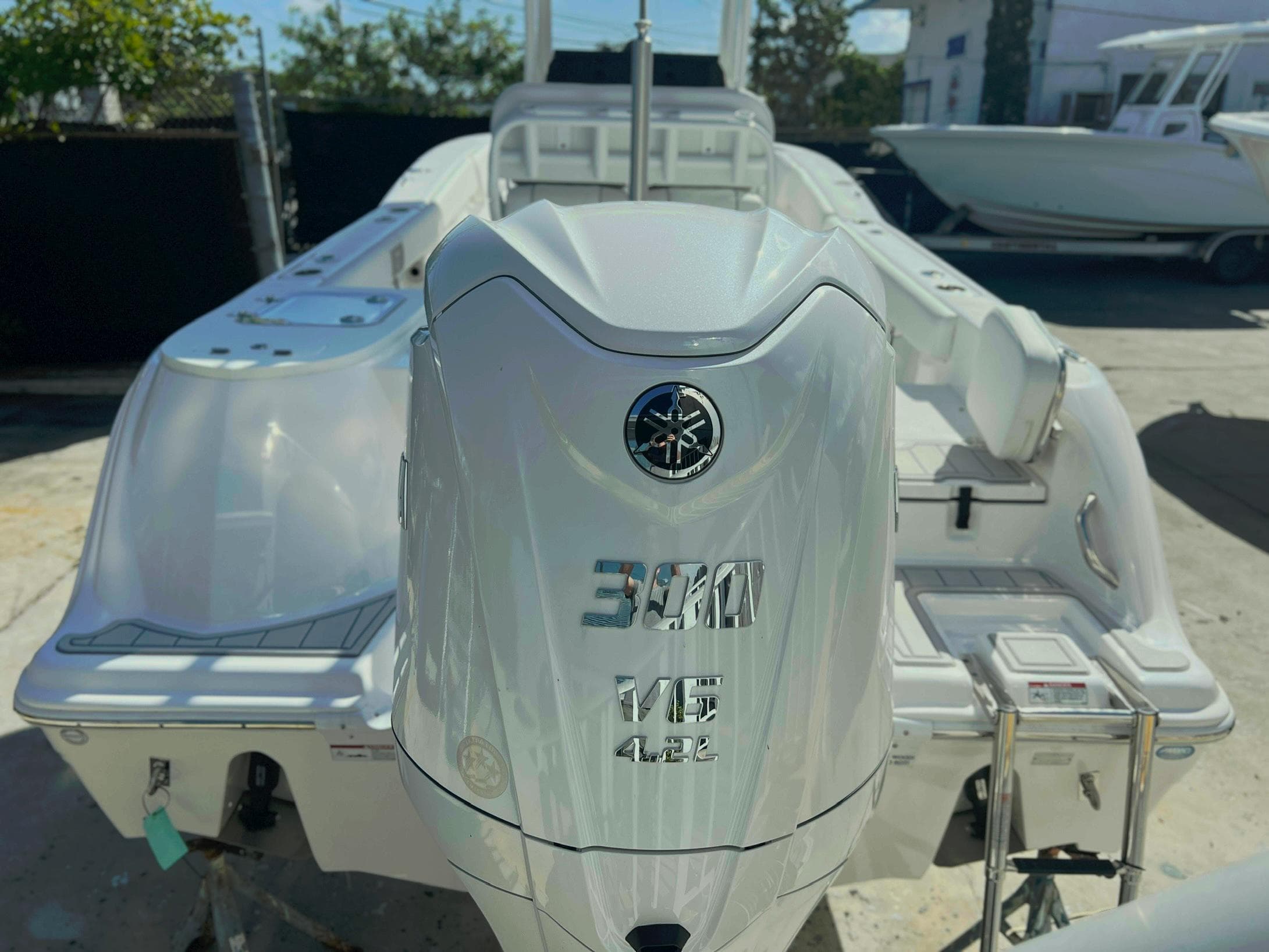 2025 Sea Fox 248 Commander boat with powerful outboard motor in a sunny marina.