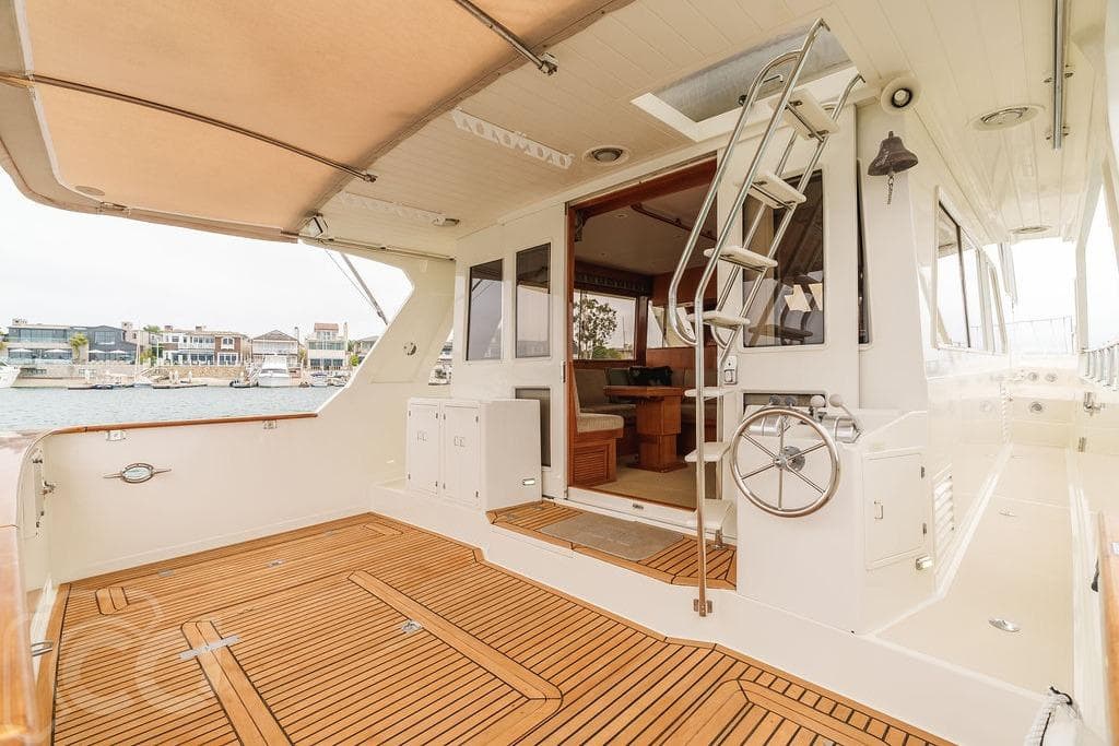 1999 Offshore Yachts 52 Pilothouse, spacious deck with teak flooring and elegant interior.