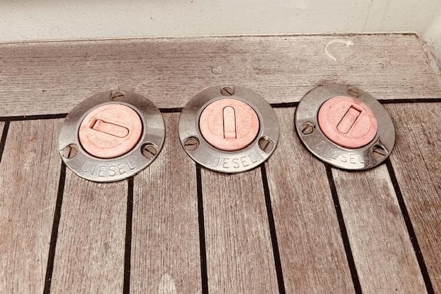 Diesel fuel caps on 1993 Brooklin Boat Yard Marshall 48 wooden deck.