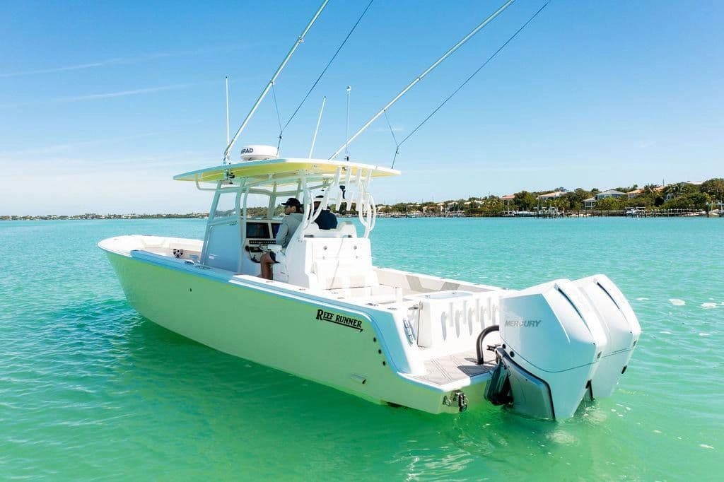 2023 Reef Runner 340 Center Console on turquoise water.