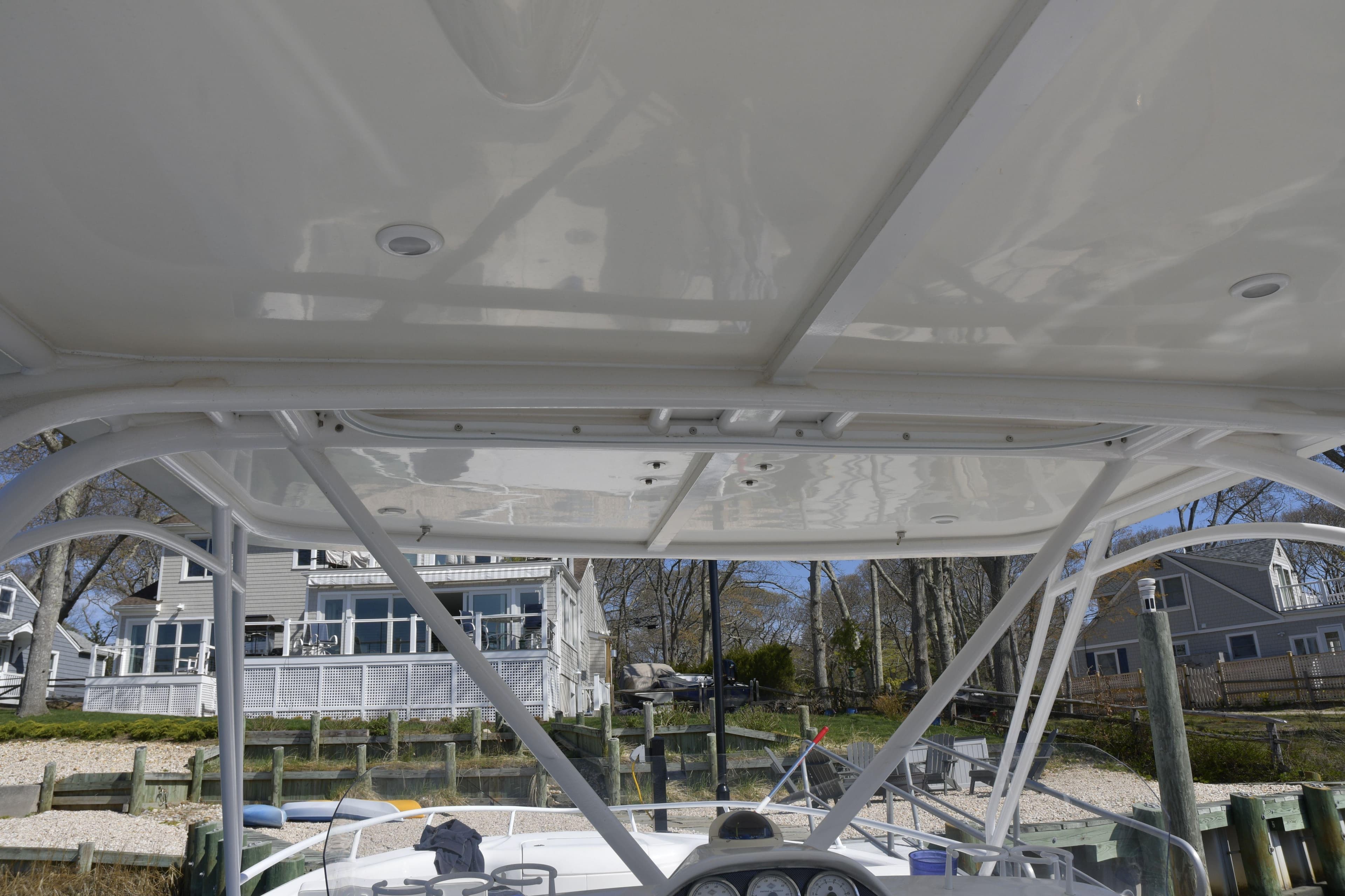 2010 Deep Impact 36 TE boat with a view of the helm and canopy.