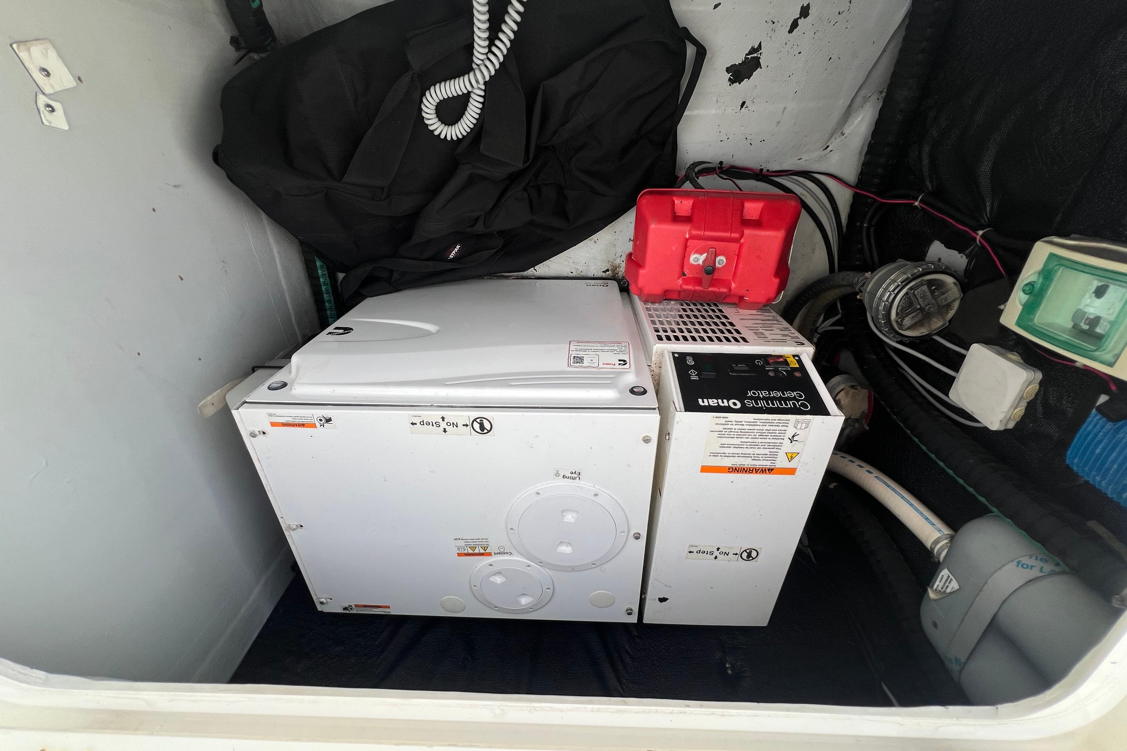 Electrical compartment of a 2018 Lagoon 42 catamaran with Cummins Onan generator.