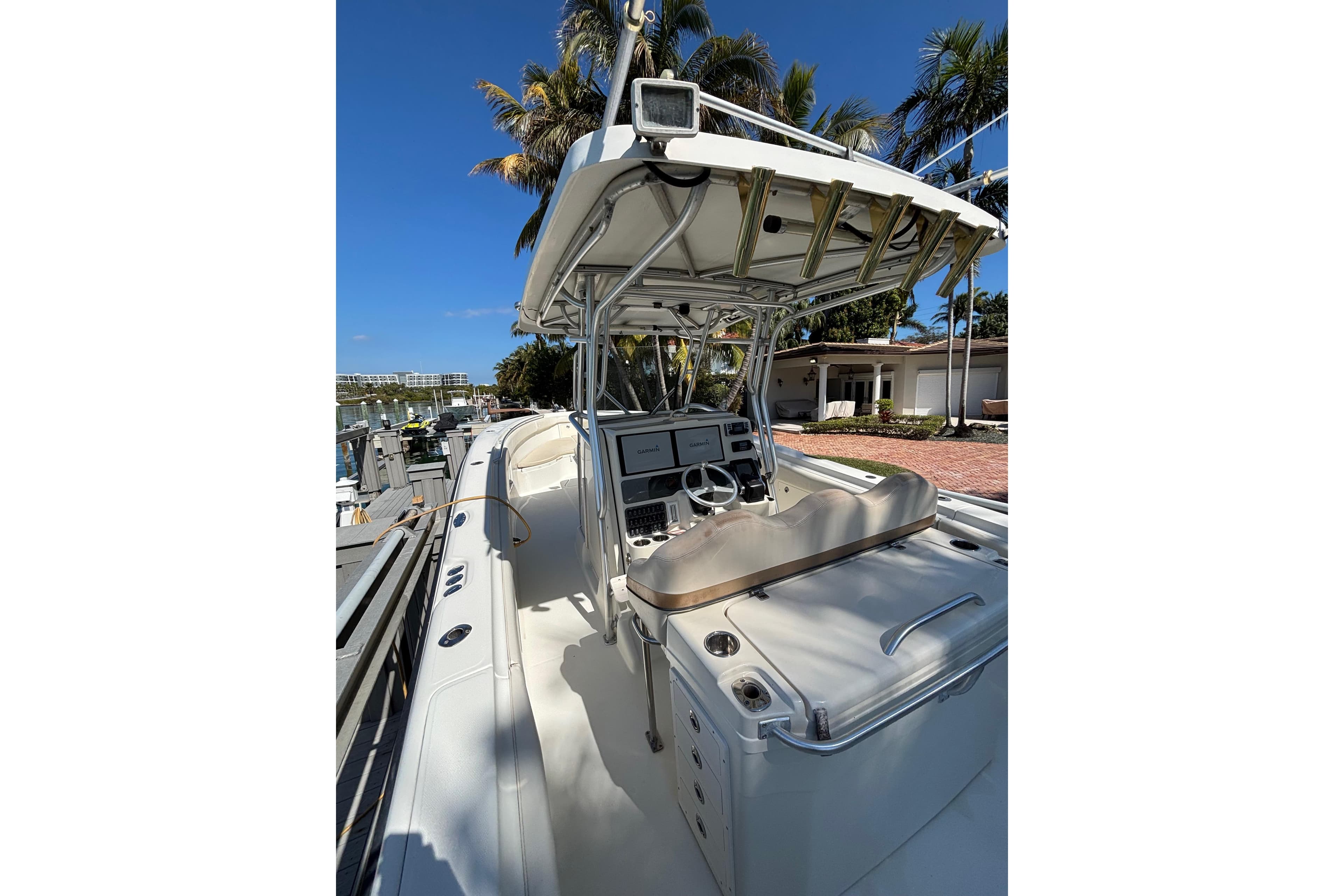 2006 Hydra-Sports Vector 3300 CC boat docked, featuring a sleek console and canopy.