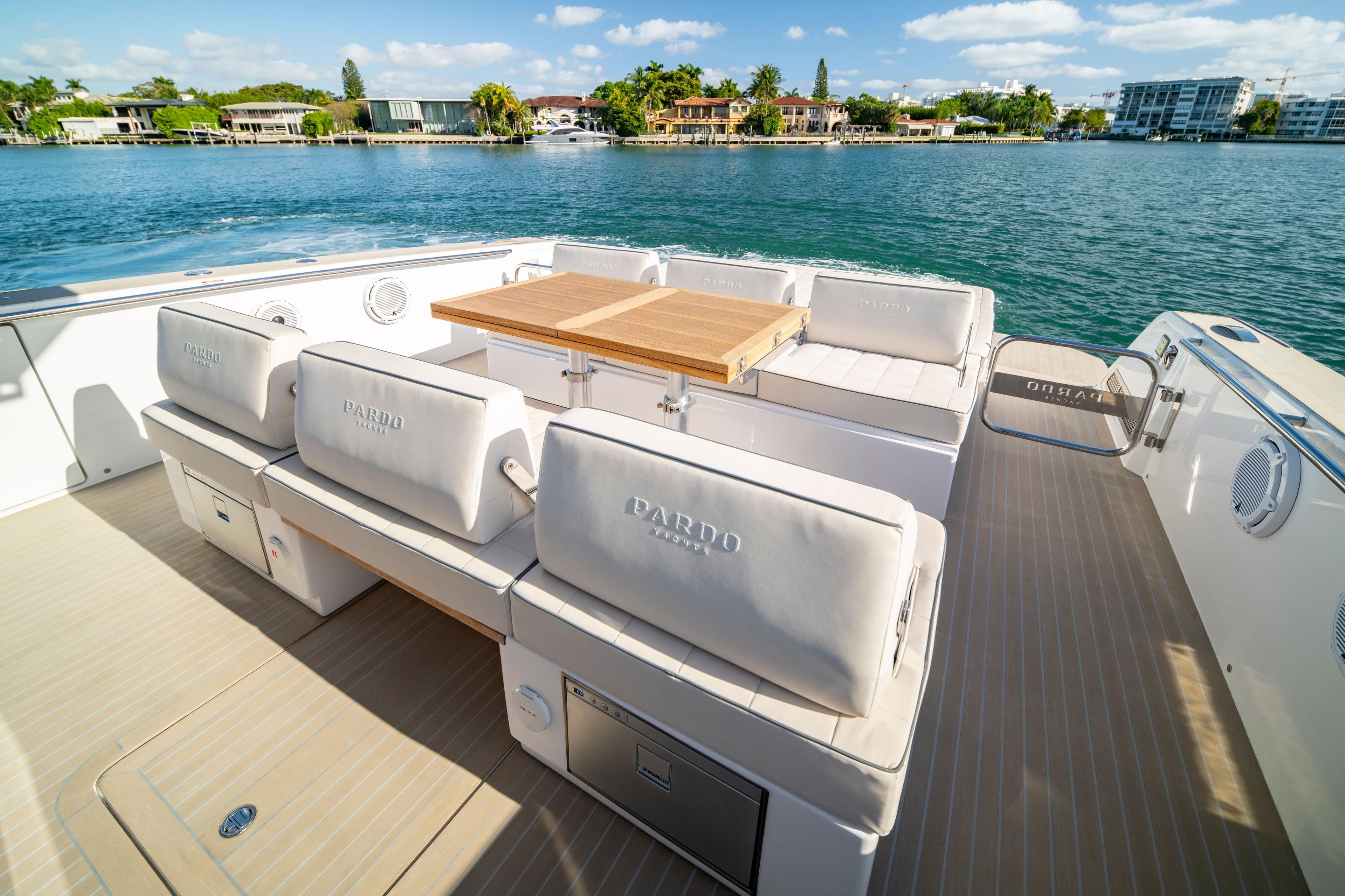 Luxurious 2024 Pardo Yachts P43 deck with elegant seating and scenic waterfront view.