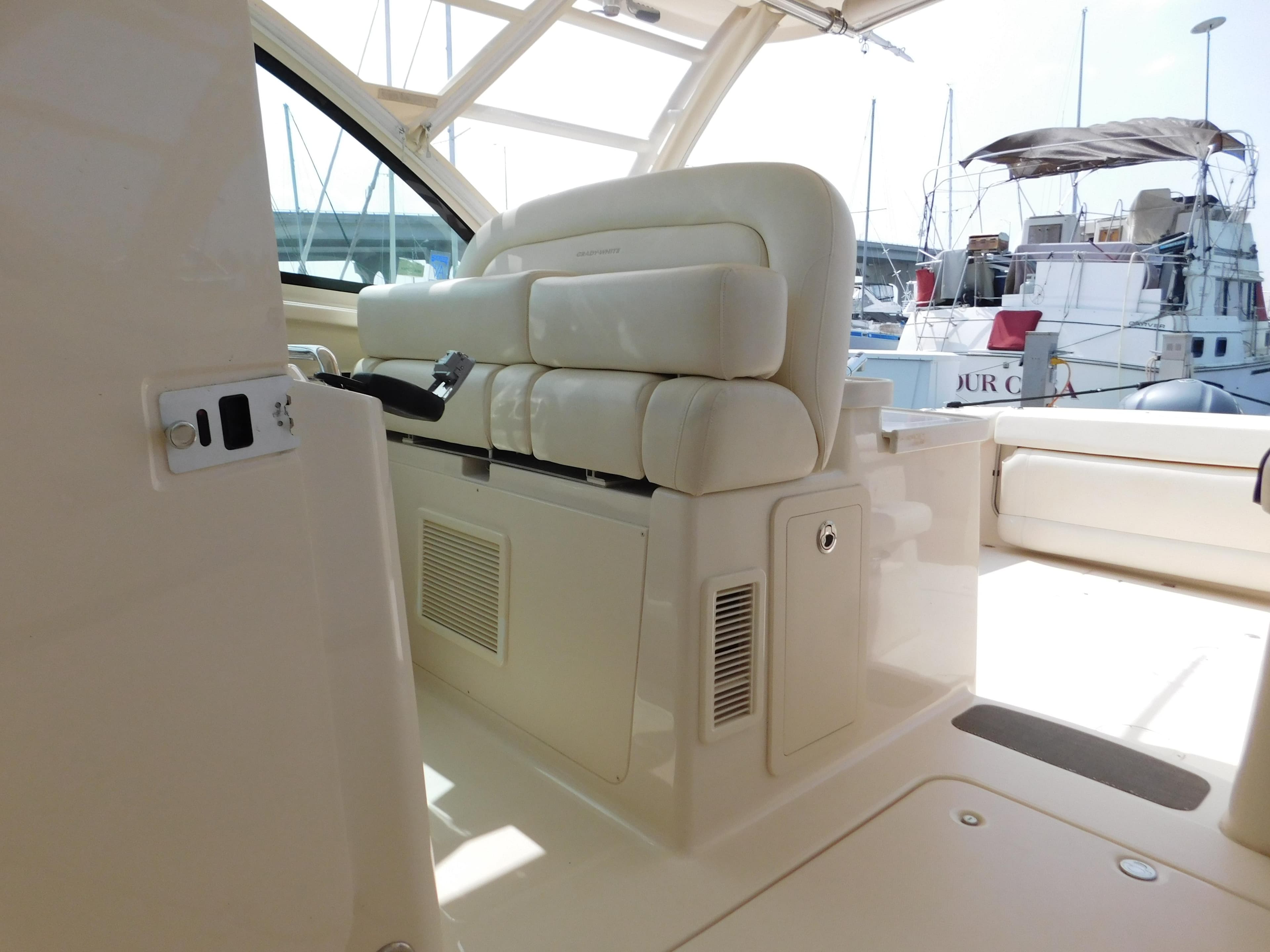 2018 Grady-White Freedom 375 boat interior with cushioned seating and control panel.