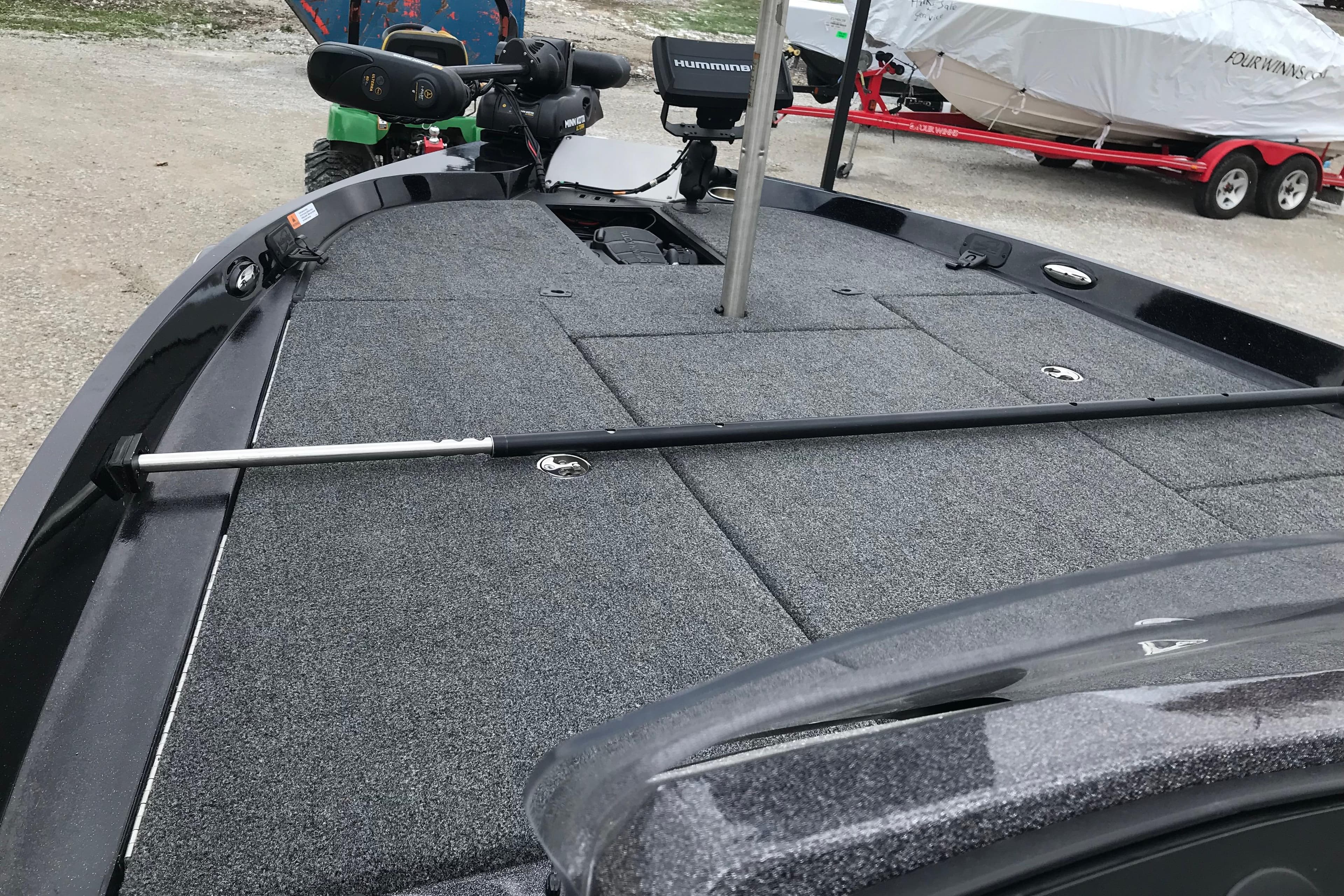 2022 Ranger Z185 boat deck with fishing rod and equipment, parked on gravel.