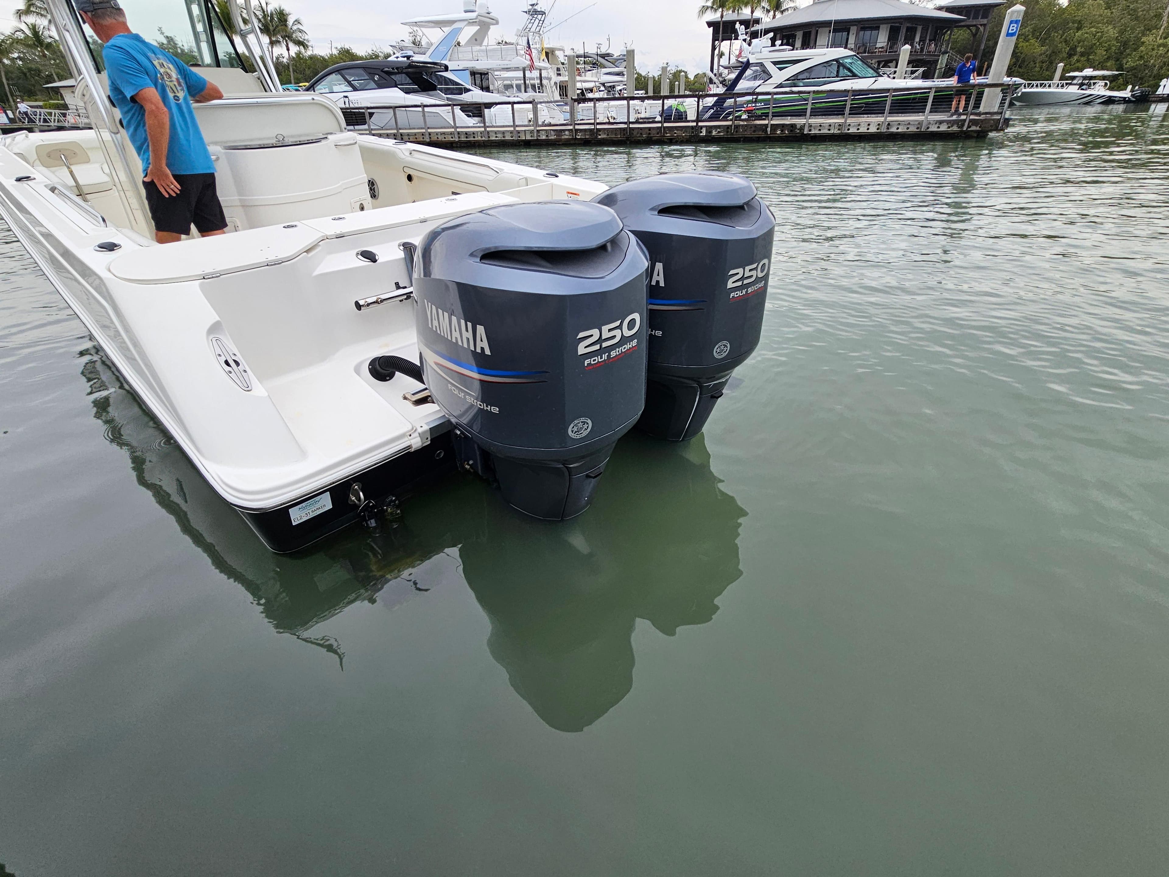 2008 Wellcraft 27 Scarab Tournament with twin Yamaha 250 engines docked in marina.
