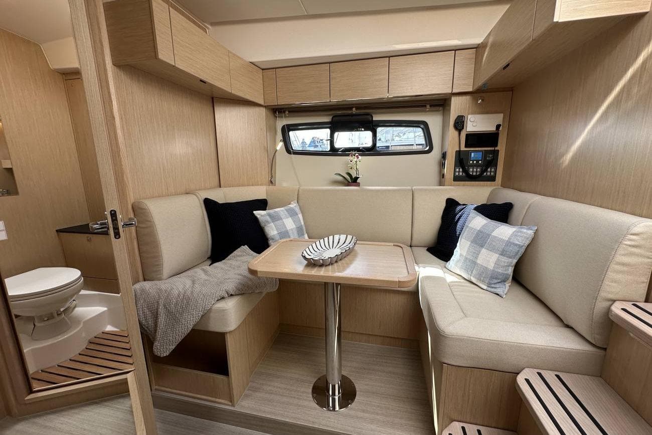 Luxurious interior of 2025 Bavaria SR41 yacht with cozy seating and modern amenities.
