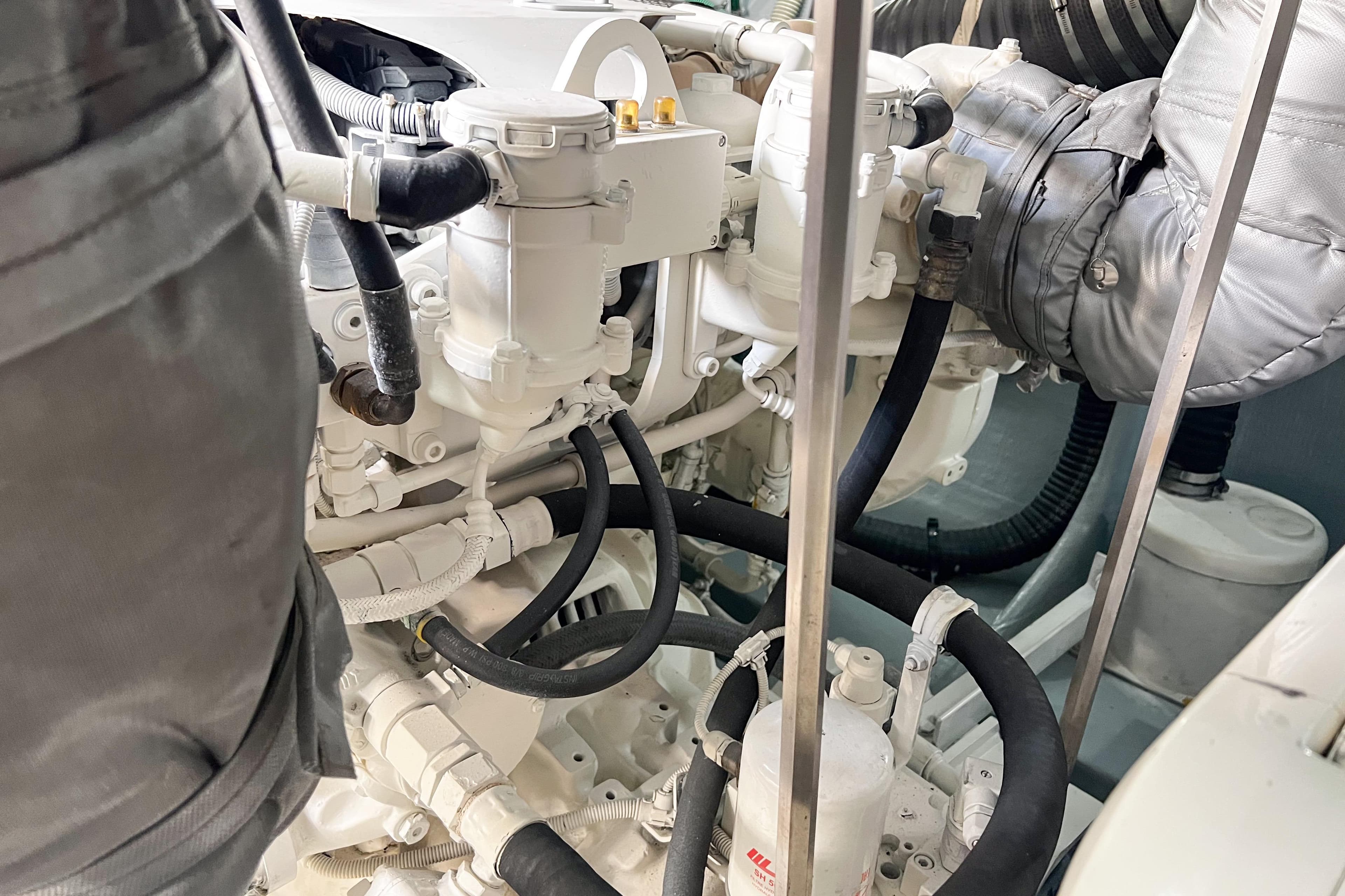 Engine room of a 2007 Sunseeker Manhattan 66 yacht, showcasing mechanical components.
