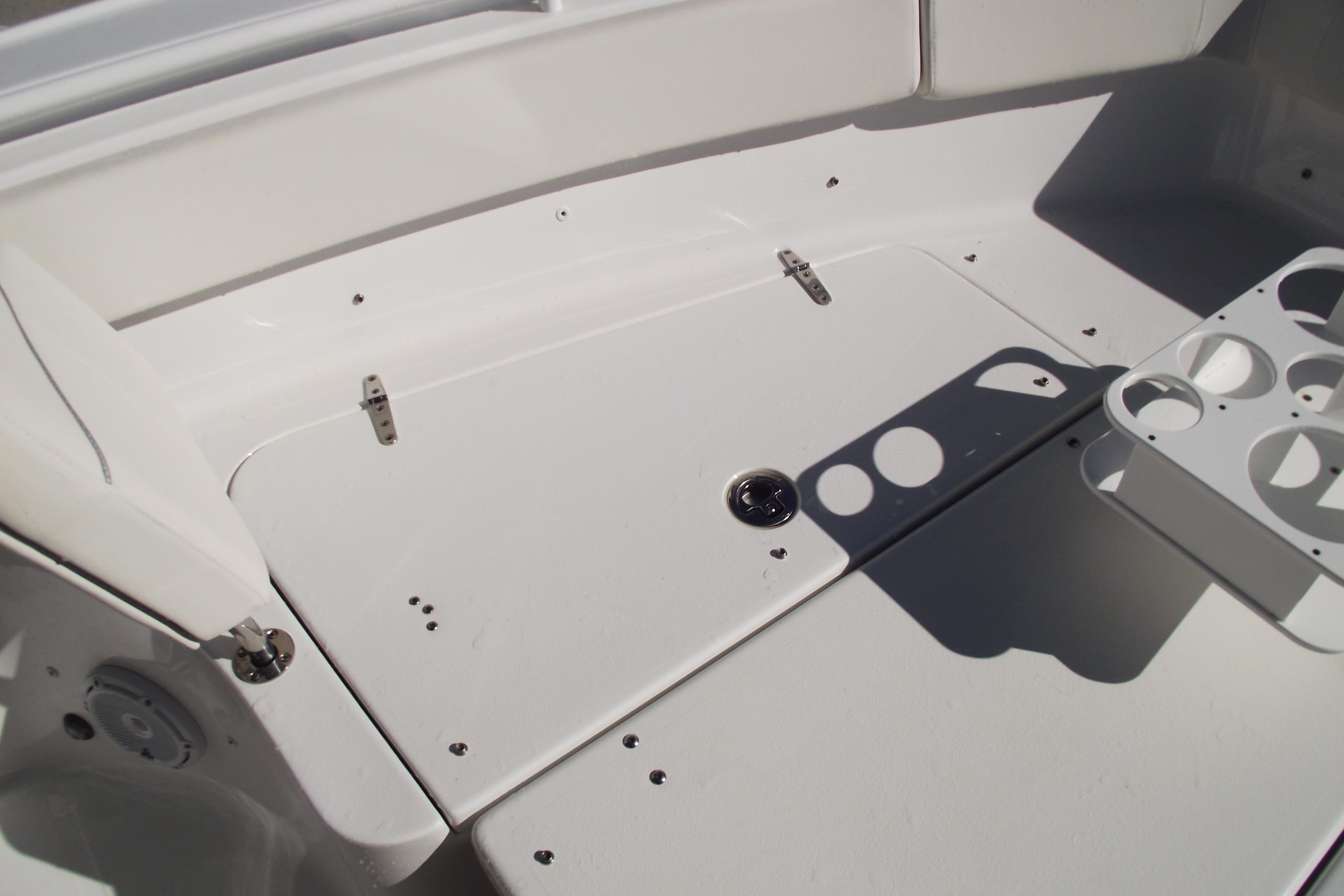 2023 Sea Hunt Ultra 255 SE boat interior with cup holders and storage compartment.