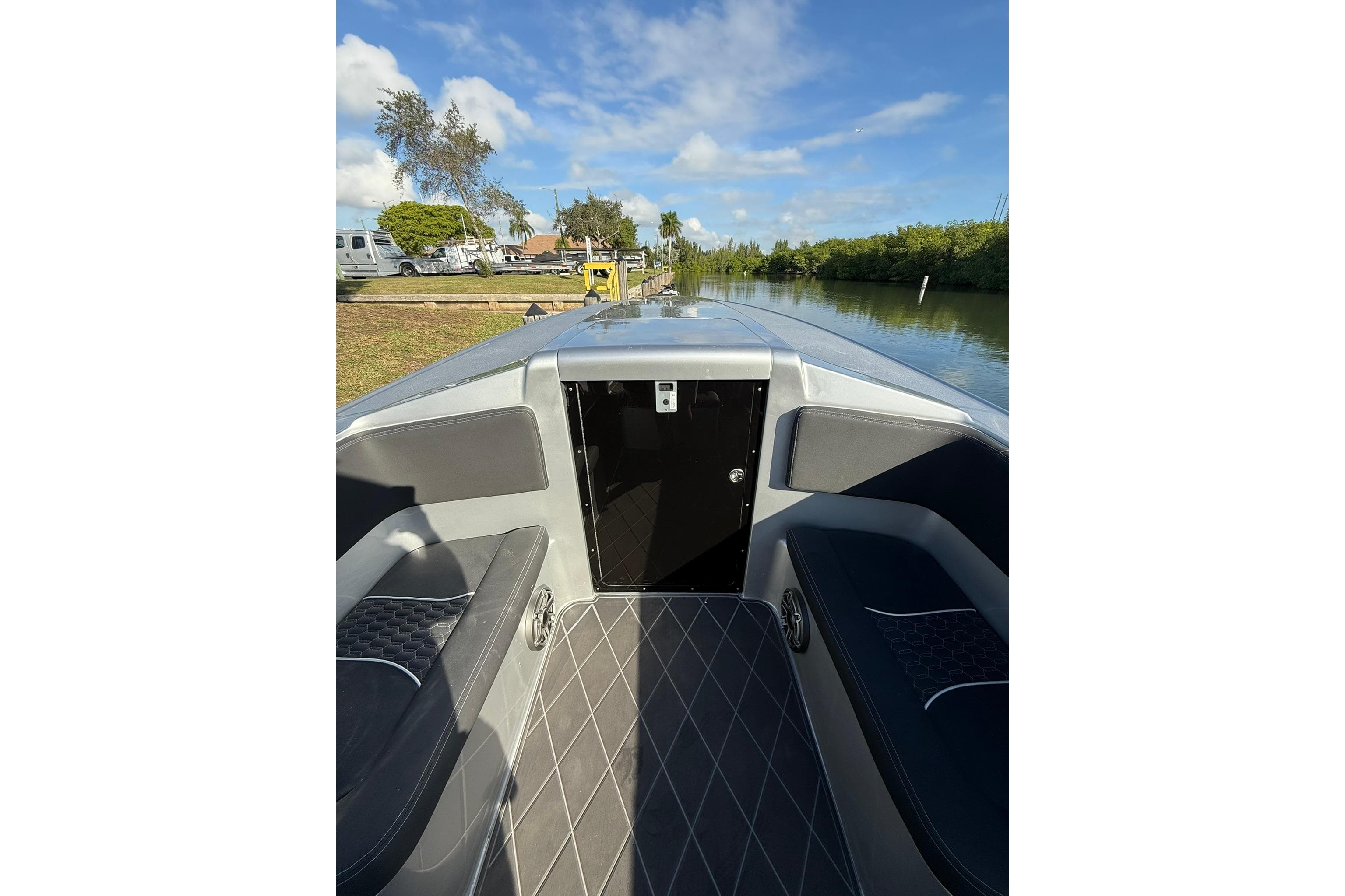 2006 Lazer 40 boat interior with sleek seating and scenic waterway view.