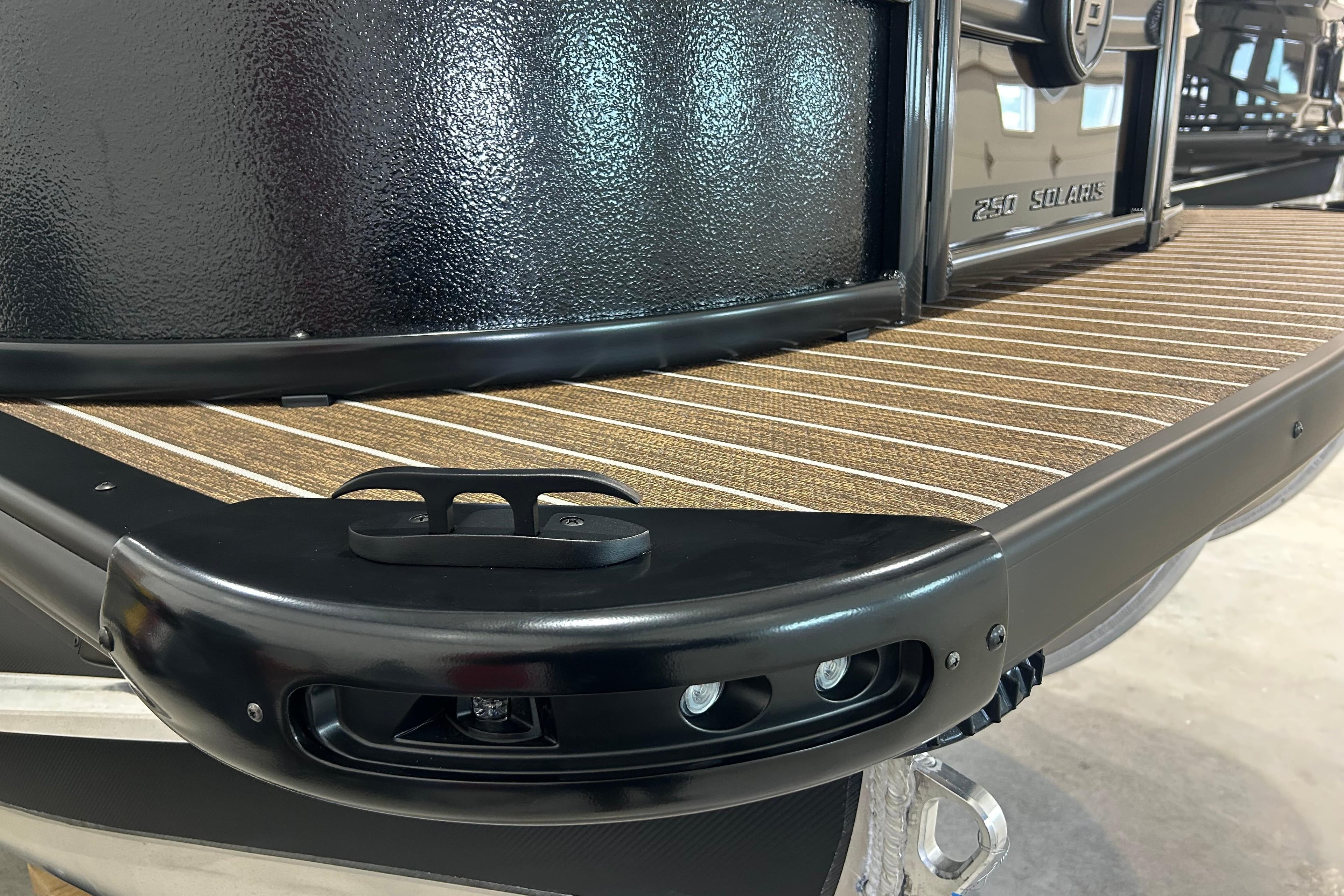 2026 Premier 250 Solaris RS boat deck with sleek black trim and textured flooring.