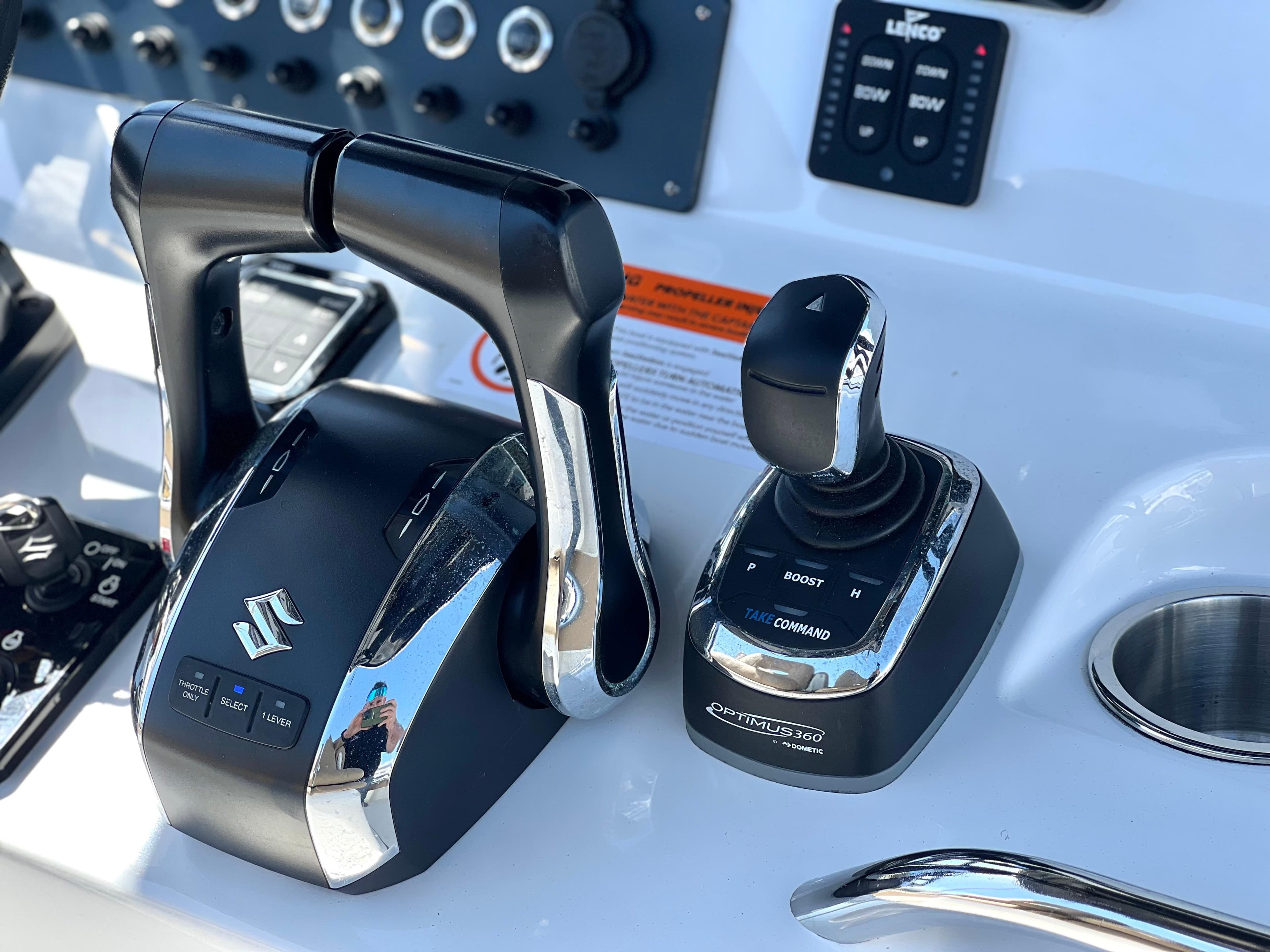 Control panel of 2022 Cape Horn 24 XS boat with Suzuki throttle and joystick.