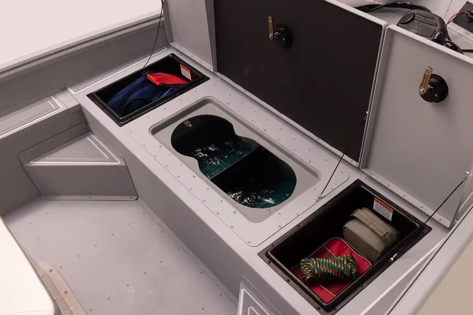 Interior storage compartments of 2026 G3 Bay 17 boat, featuring organized gear and equipment.