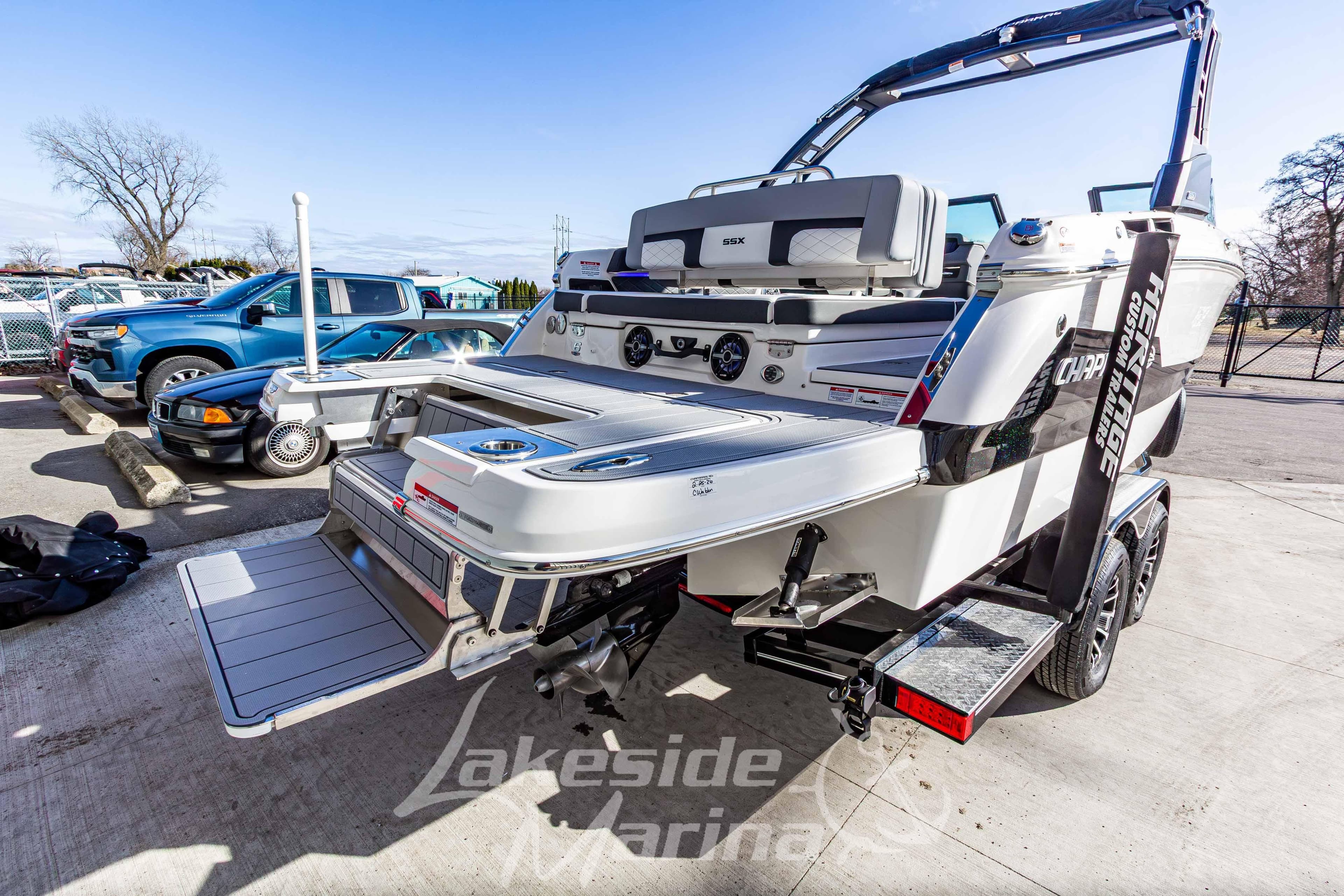 2026 Chaparral SSX 6 boat on trailer at Lakeside Marina, showcasing rear deck and seating.