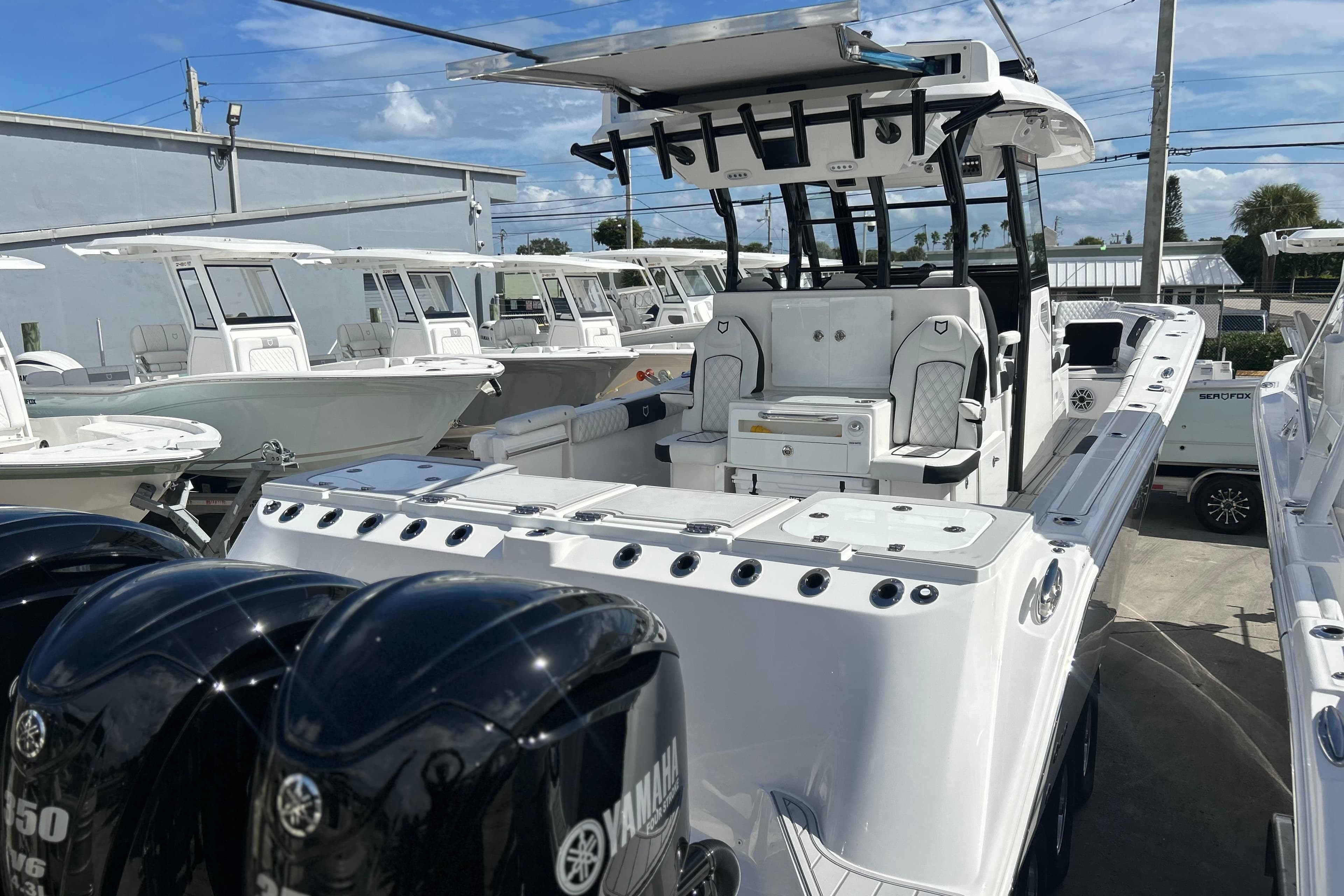 2026 Sea Fox 368 Commander boat with Yamaha engines, docked under a clear blue sky.