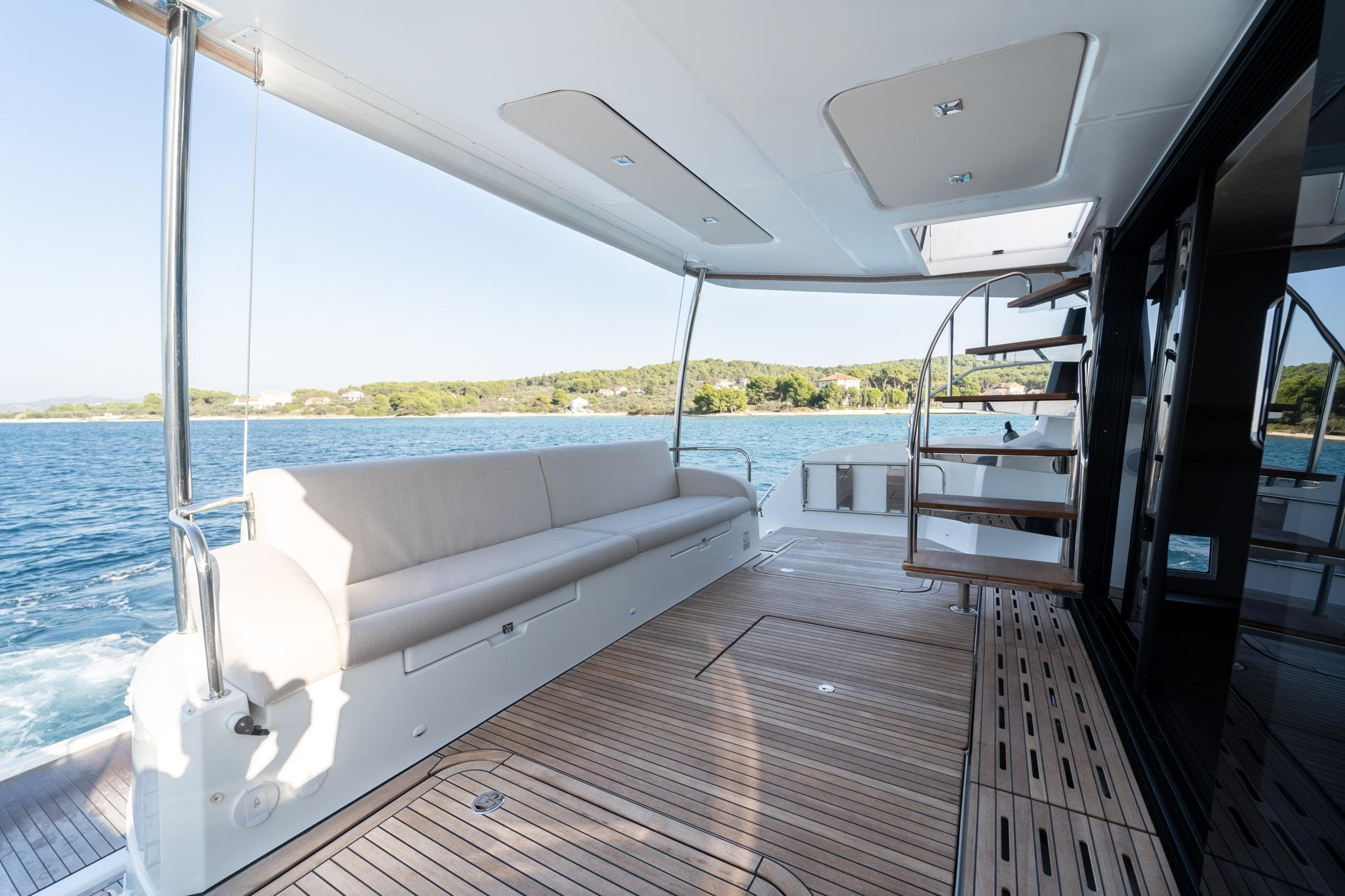 Luxurious 2023 Fountaine Pajot MY 6 yacht deck with seating and ocean view.