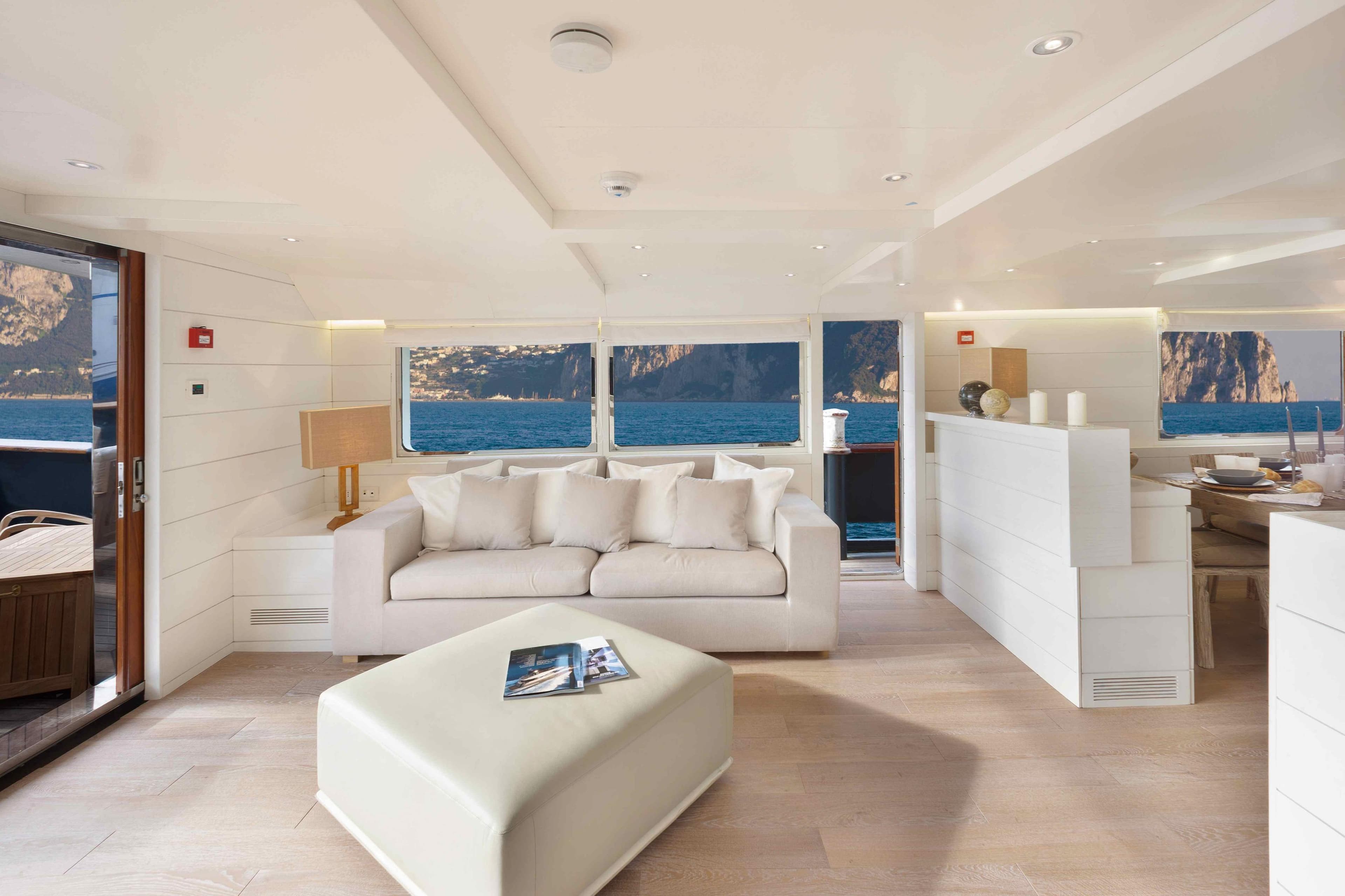 Luxurious interior of 2013 Benetti Explorer Trawler 30m yacht with ocean view.