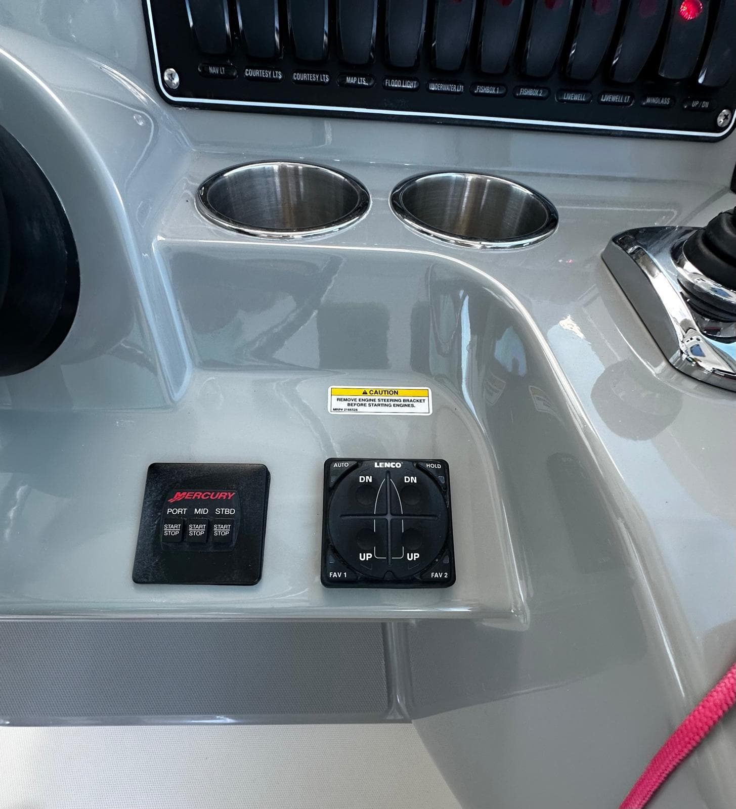 2015 Boston Whaler 345 Conquest dashboard with controls and cup holders.