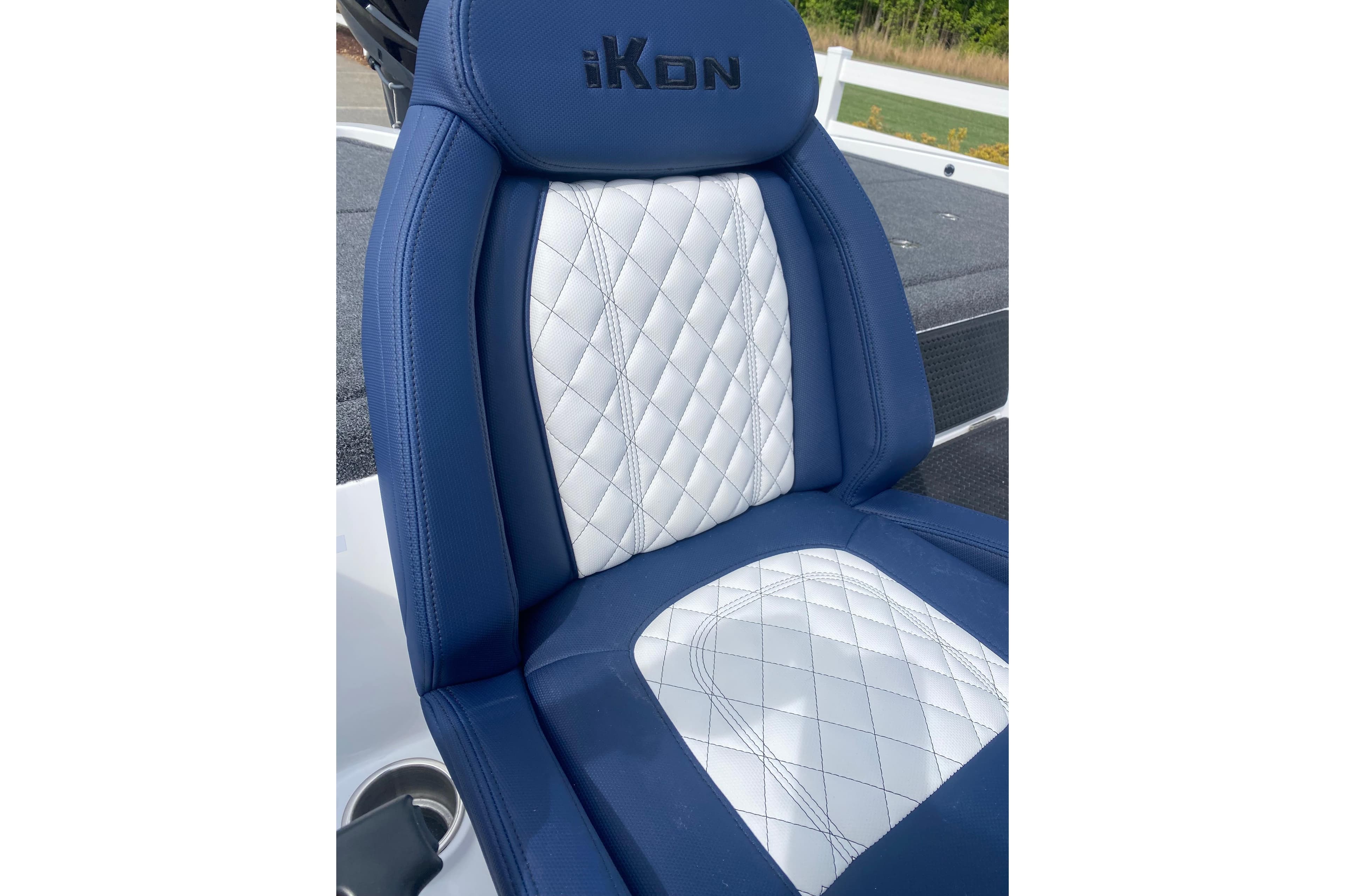 Blue and white quilted seat of 2026 iKon LXE21 boat.