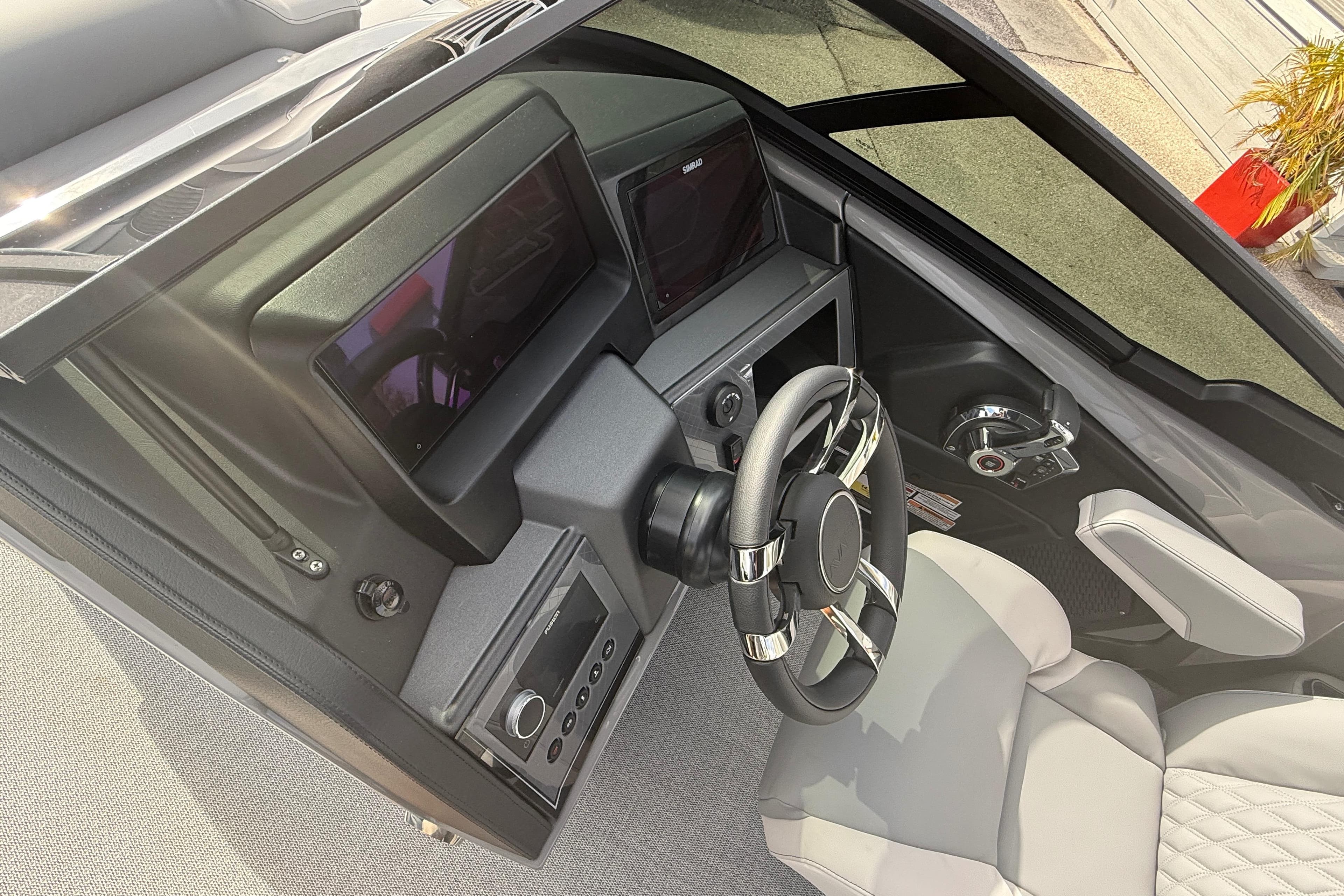 2026 Avalon 2585 Excalibur LTD boat dashboard with modern steering and controls.