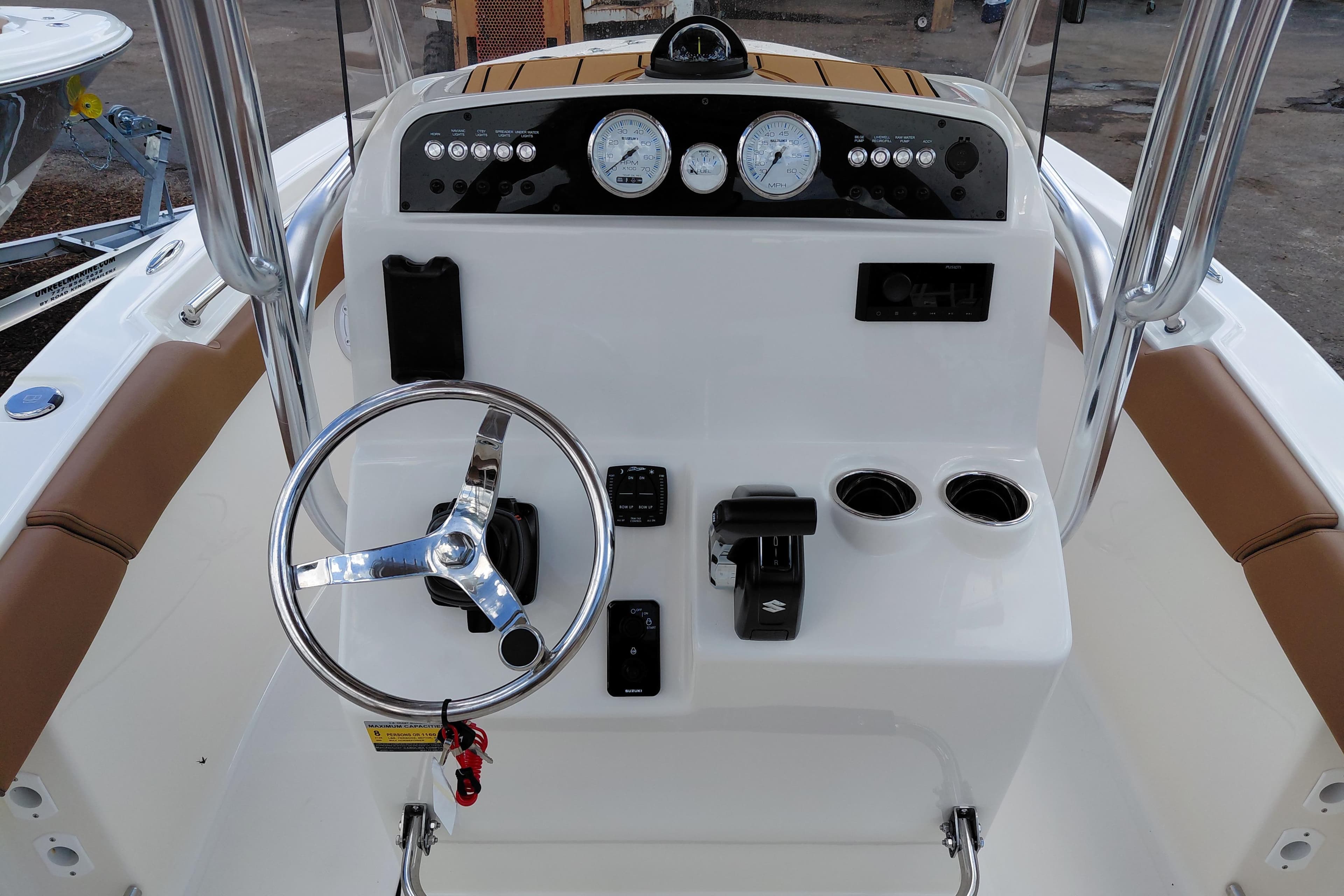 2026 Pioneer 202 Islander boat console with steering wheel, gauges, and controls.
