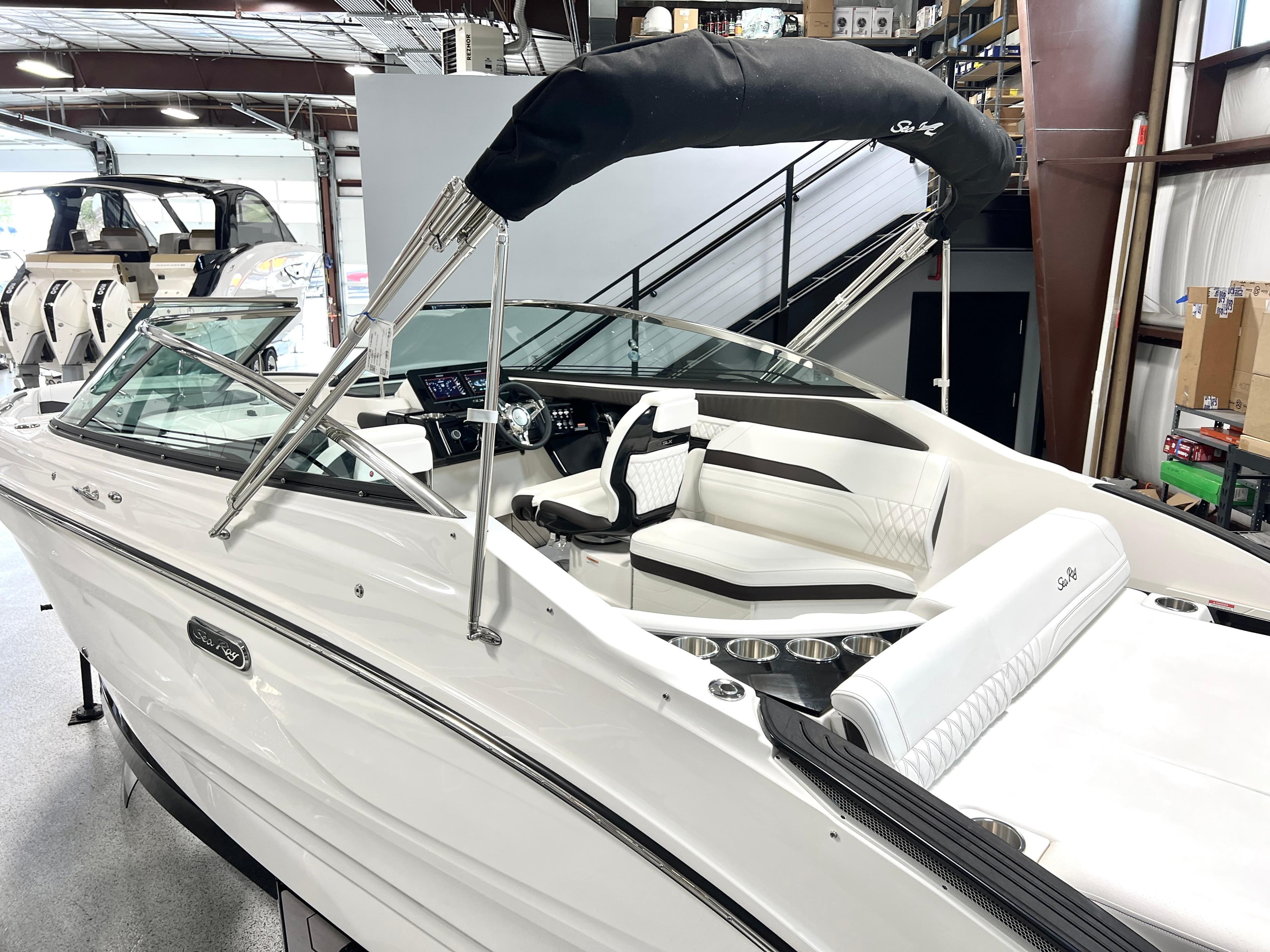 2024 Sea Ray SLX 260 boat with sleek design in showroom.