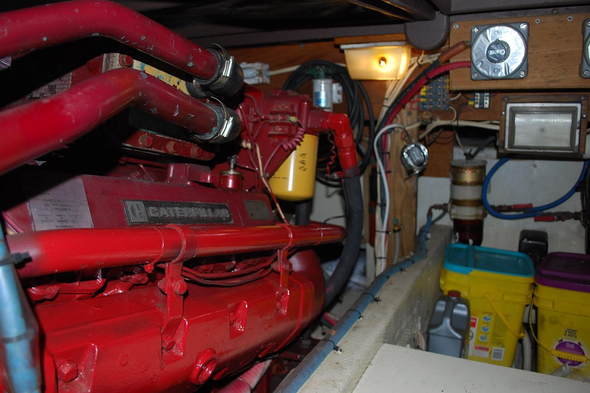 Engine room of 1987 Jersey Dawn boat with Caterpillar engine and various equipment.