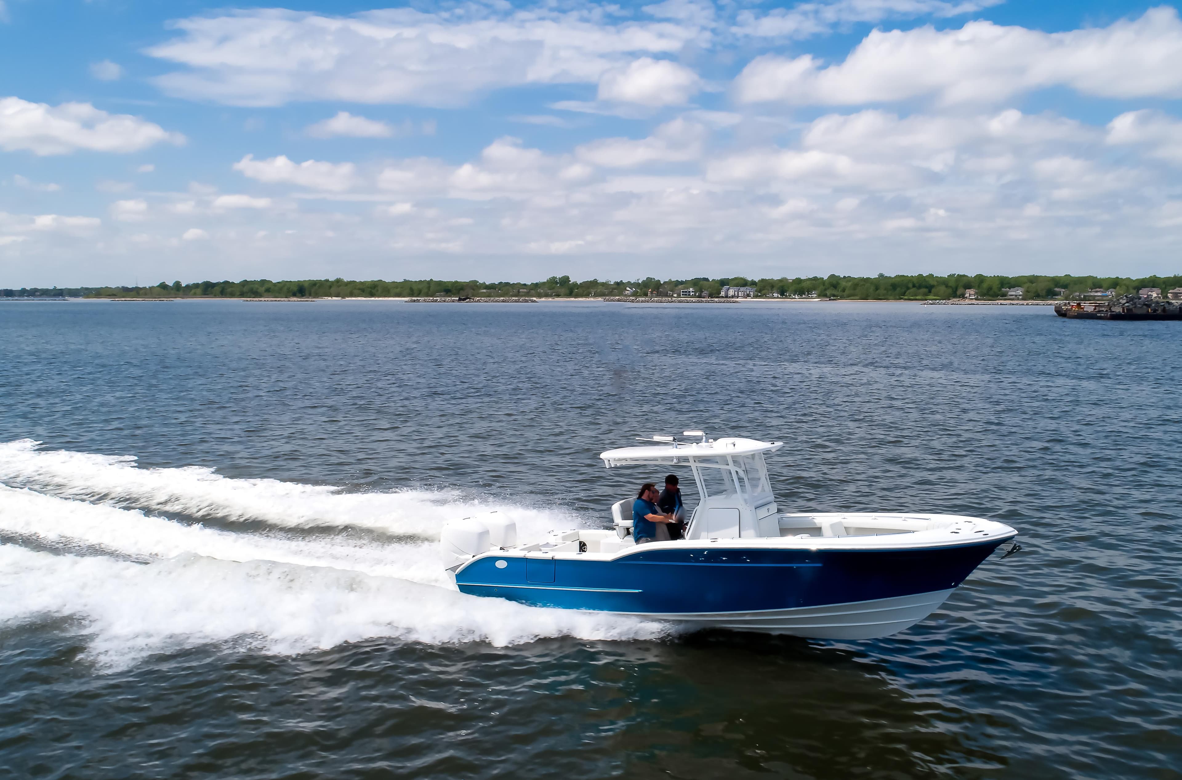 2025 Buddy Davis 28 Center Console boat cruising on open water.