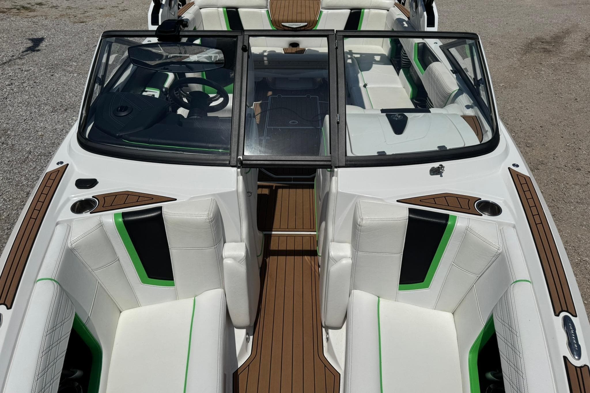 2017 Nautique Super Air Nautique G23 interior with white seats and green accents.